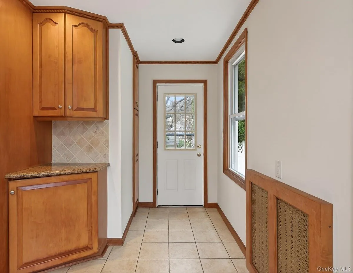 Eat-in kitchen with door to side yard and garage Eat-in kitchen with door to side yard and garage