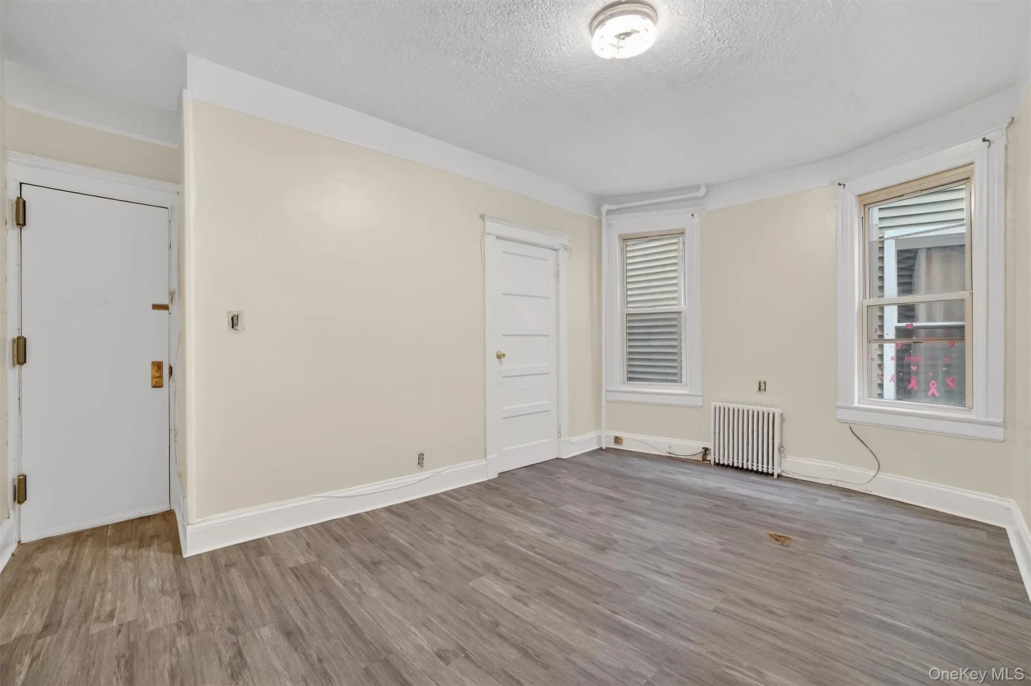 View Of living room. From Kitchen. Door to the Right is to bedrooms. Door to the left is apartment entrance View Of living room. From Kitchen. Door to the Right is to bedrooms. Door to the left is apartment entrance