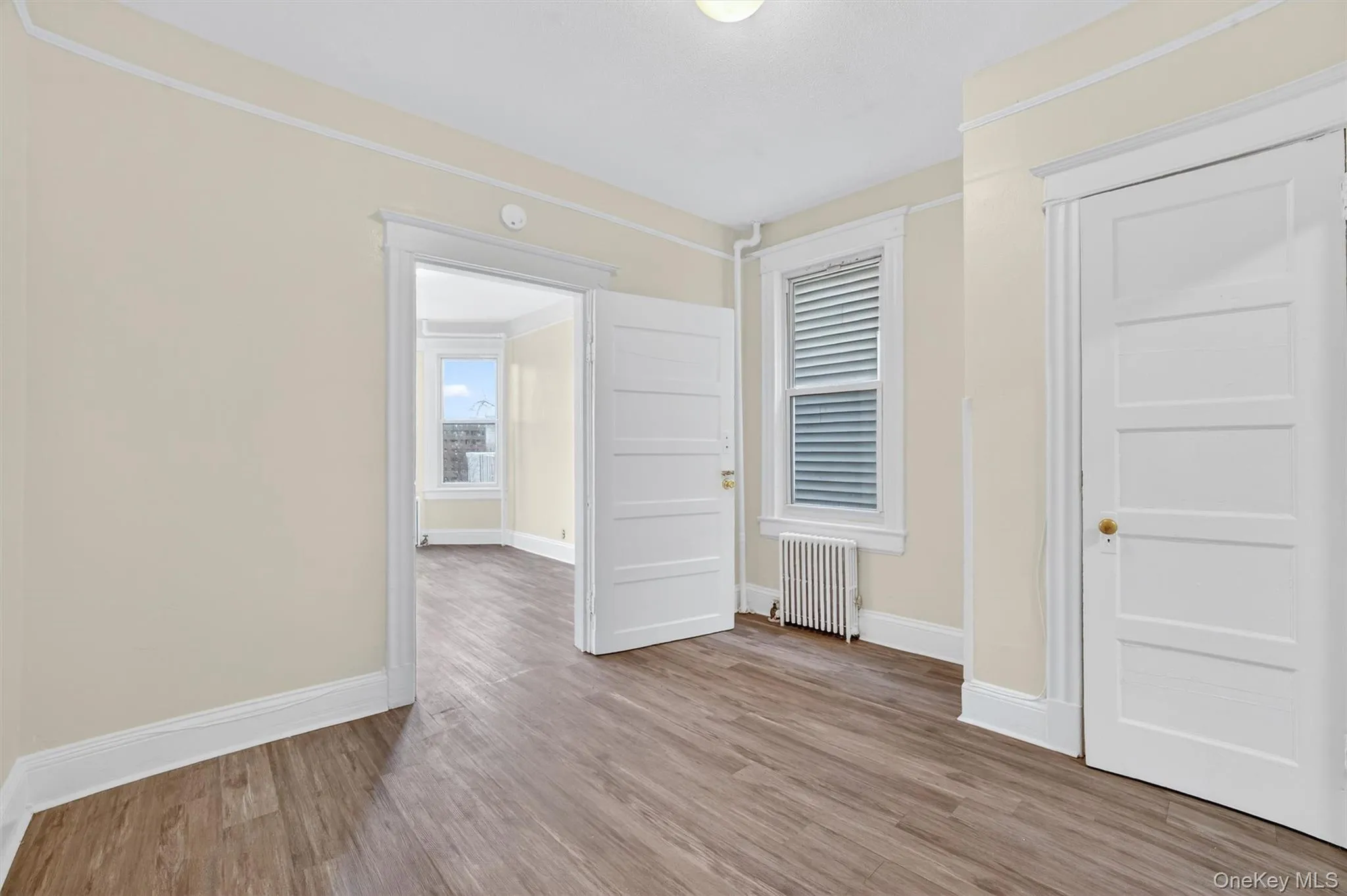 Bedroom 2 with closet and Bedroom 3 beyond Bedroom 2 with closet and Bedroom 3 beyond