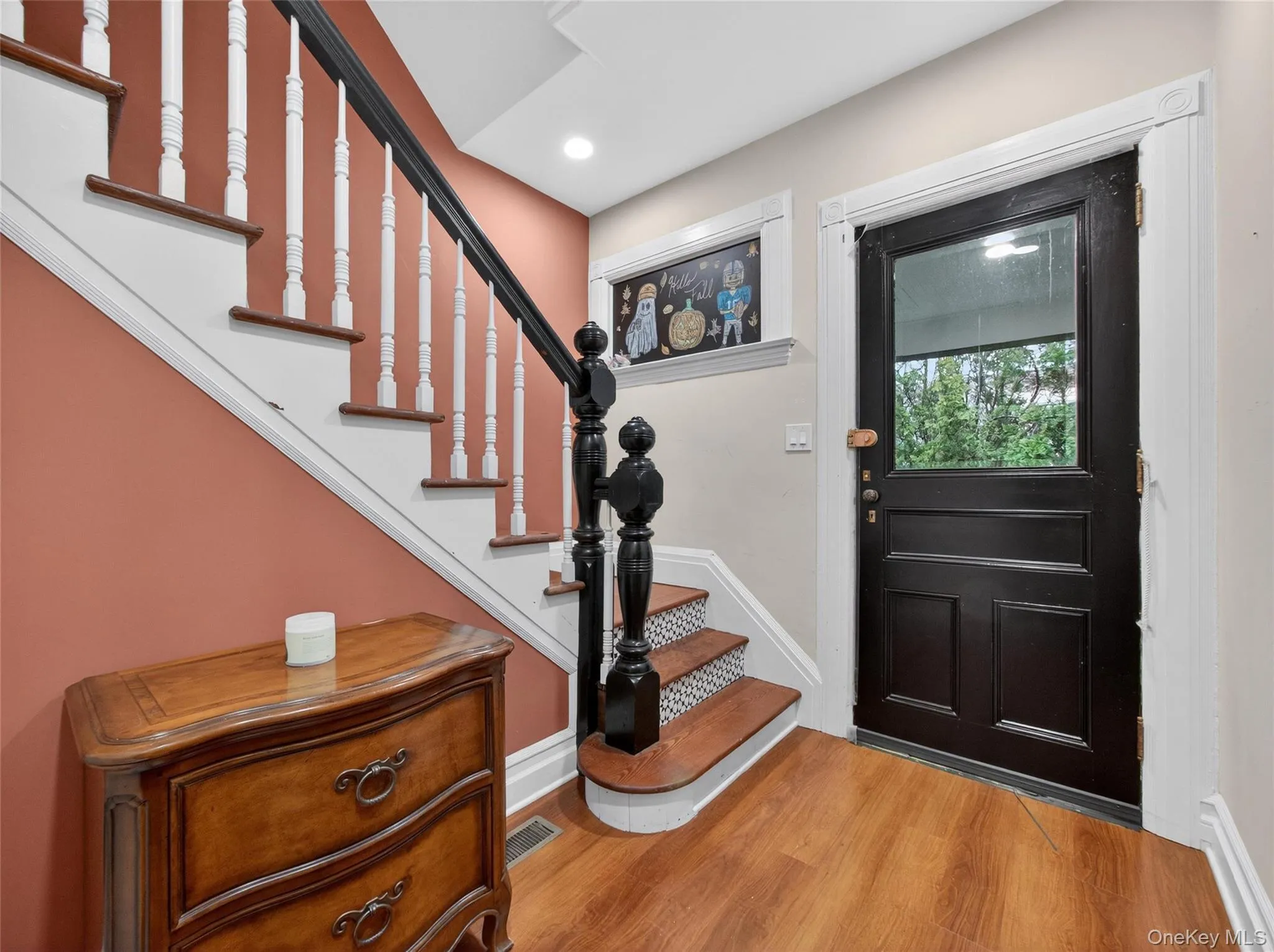 Entryway with stairway and light wood-type flooring Entryway with stairway and light wood-type flooring
