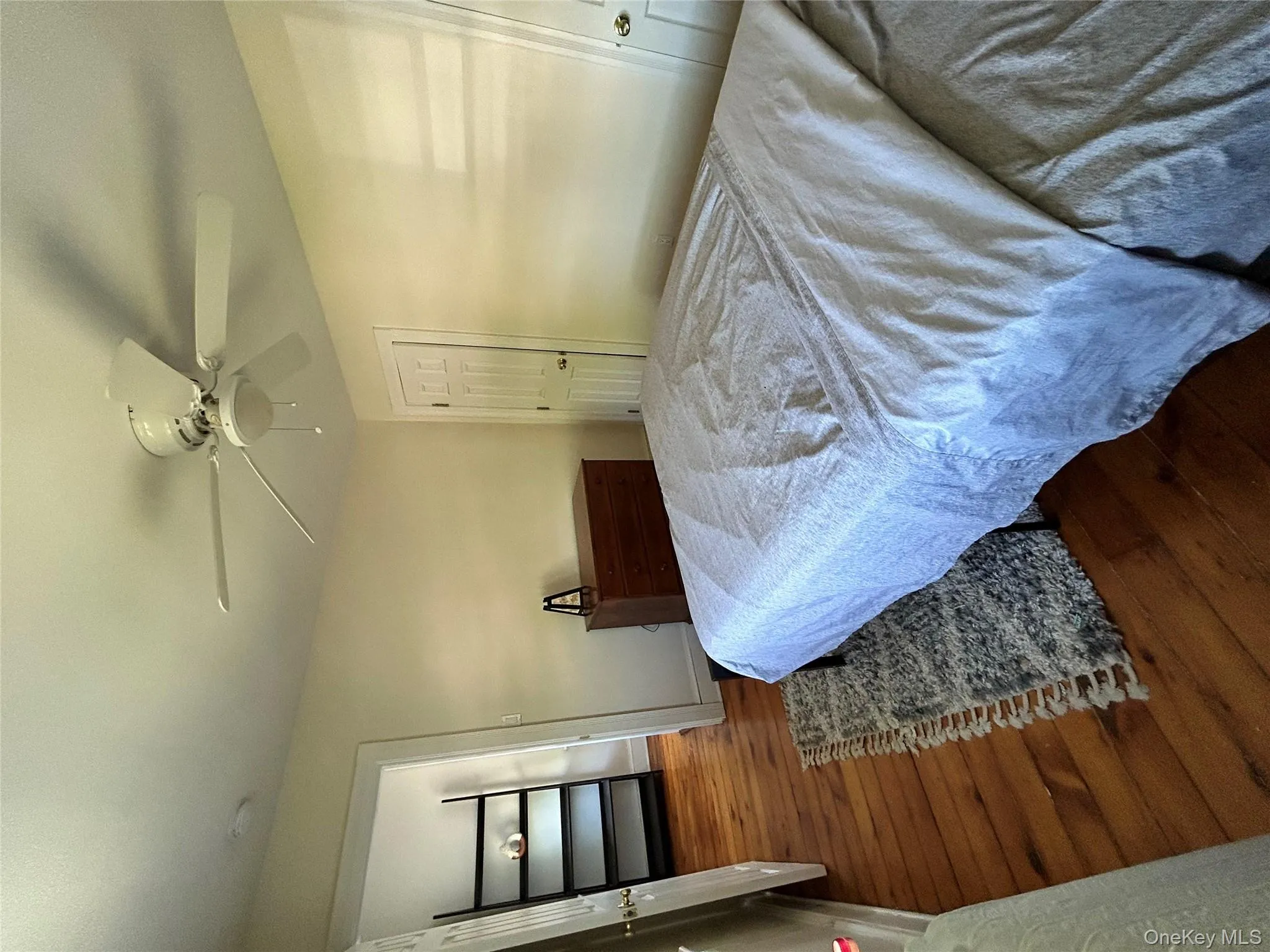 Bedroom with baseboards, ceiling fan, and wood finished floors Bedroom with baseboards, ceiling fan, and wood finished floors