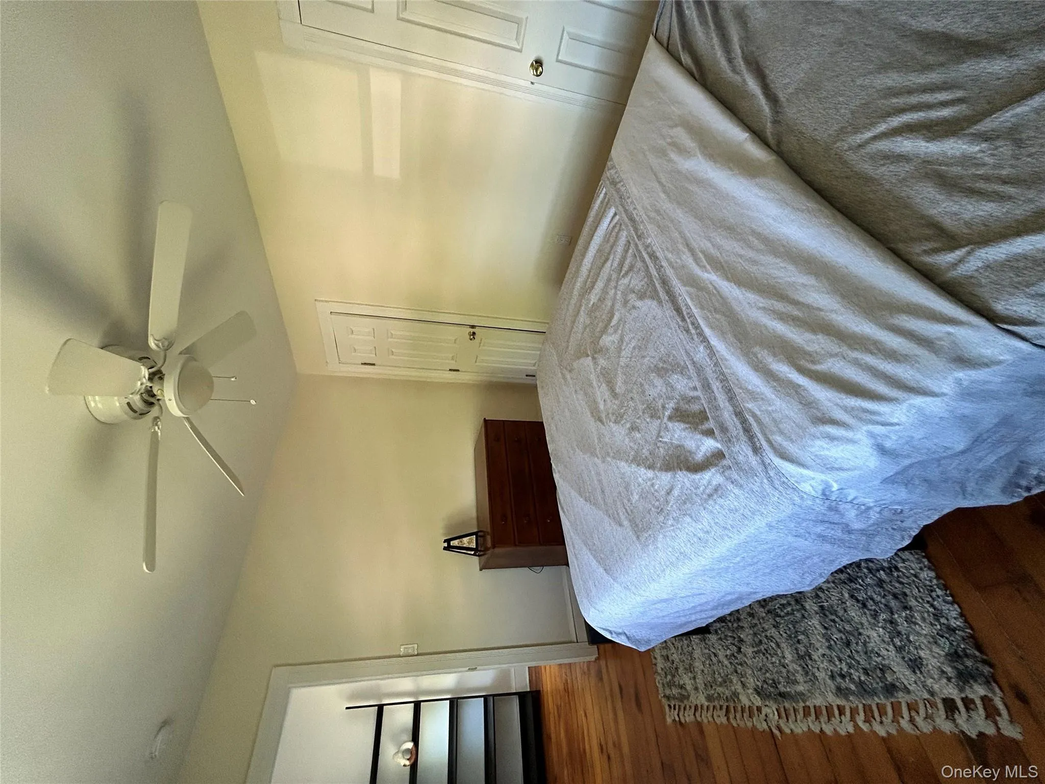 Bedroom with baseboards, a ceiling fan, and wood finished floors Bedroom with baseboards, a ceiling fan, and wood finished floors