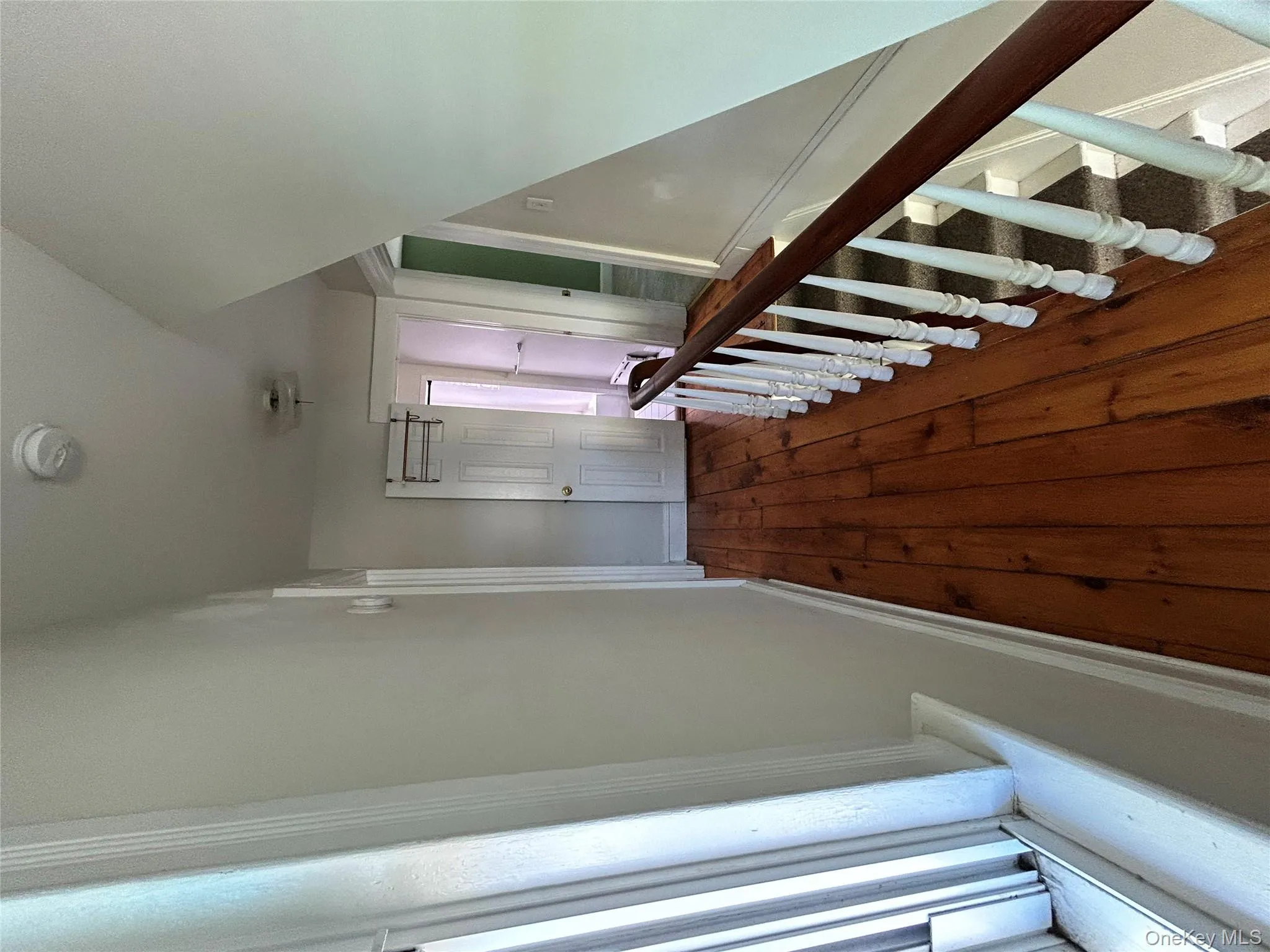 Hall with baseboards and dark wood-style floors Hall with baseboards and dark wood-style floors