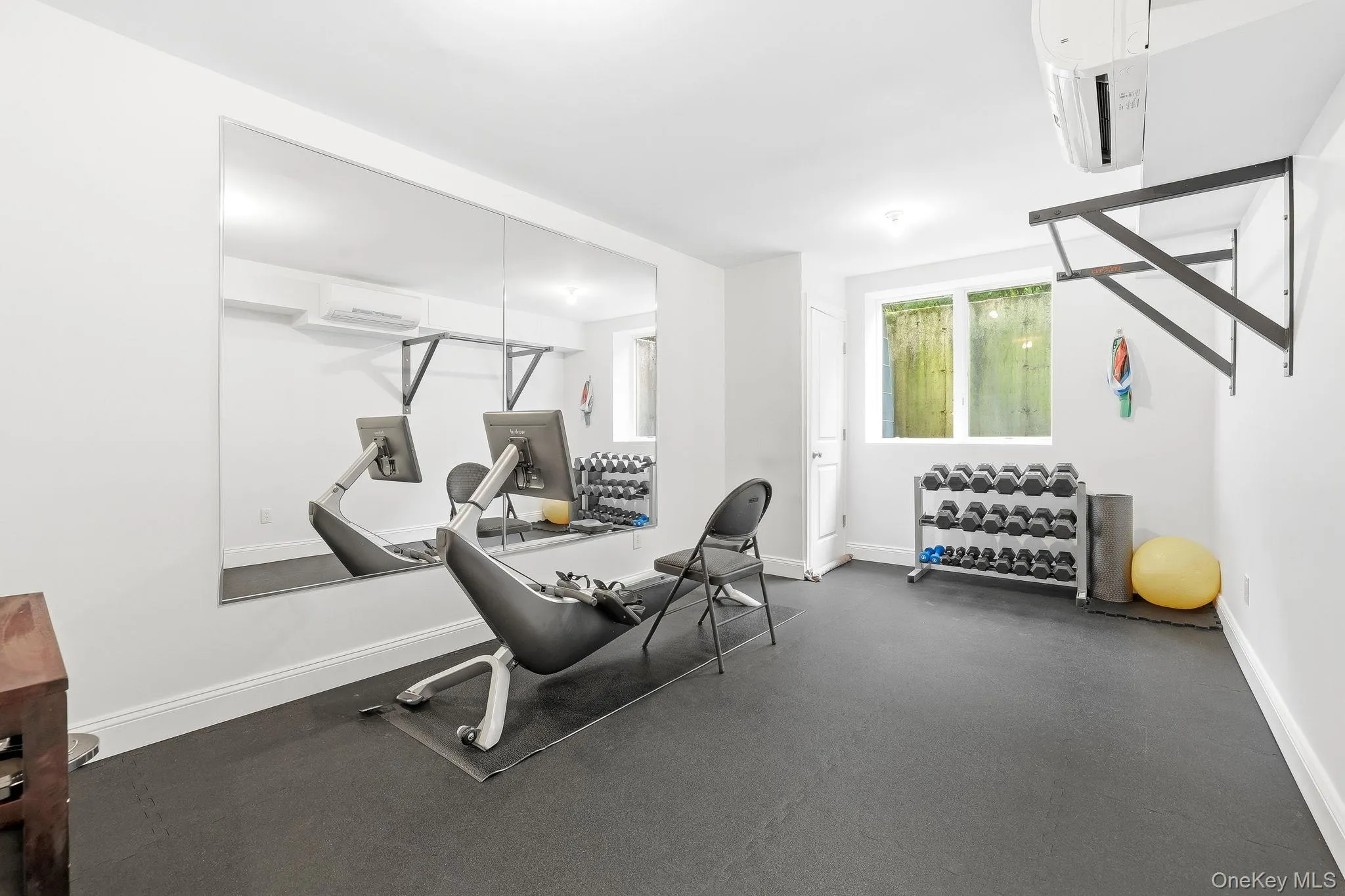 Dedicated fitness space on the lower level features large mirrors, durable rubber flooring and recessed lighting. Dedicated fitness space on the lower level features large mirrors, durable rubber flooring and recessed lighting.
