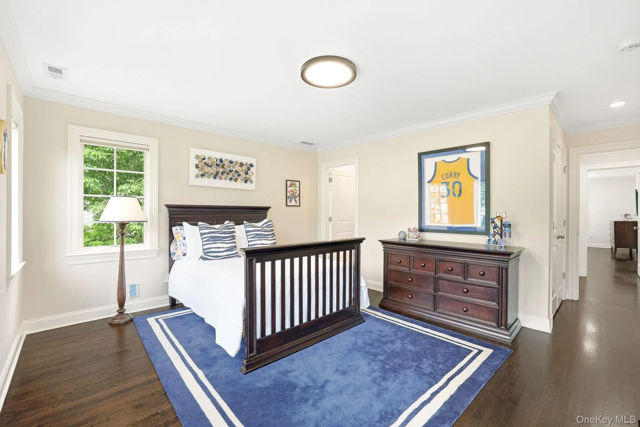 Second family bedroom with ensuite bathroom, hardwood floors, multiple exposures and outfitted closet. Second family bedroom with ensuite bathroom, hardwood floors, multiple exposures and outfitted closet.