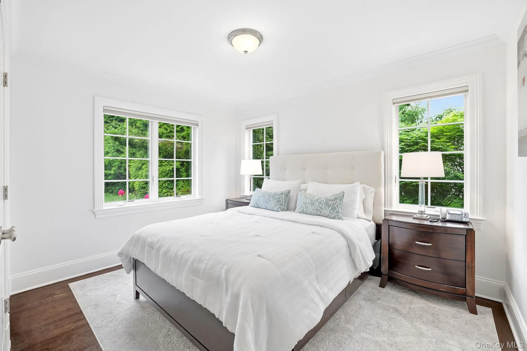First level guest bedroom overlooking the scenic property. First level guest bedroom overlooking the scenic property.