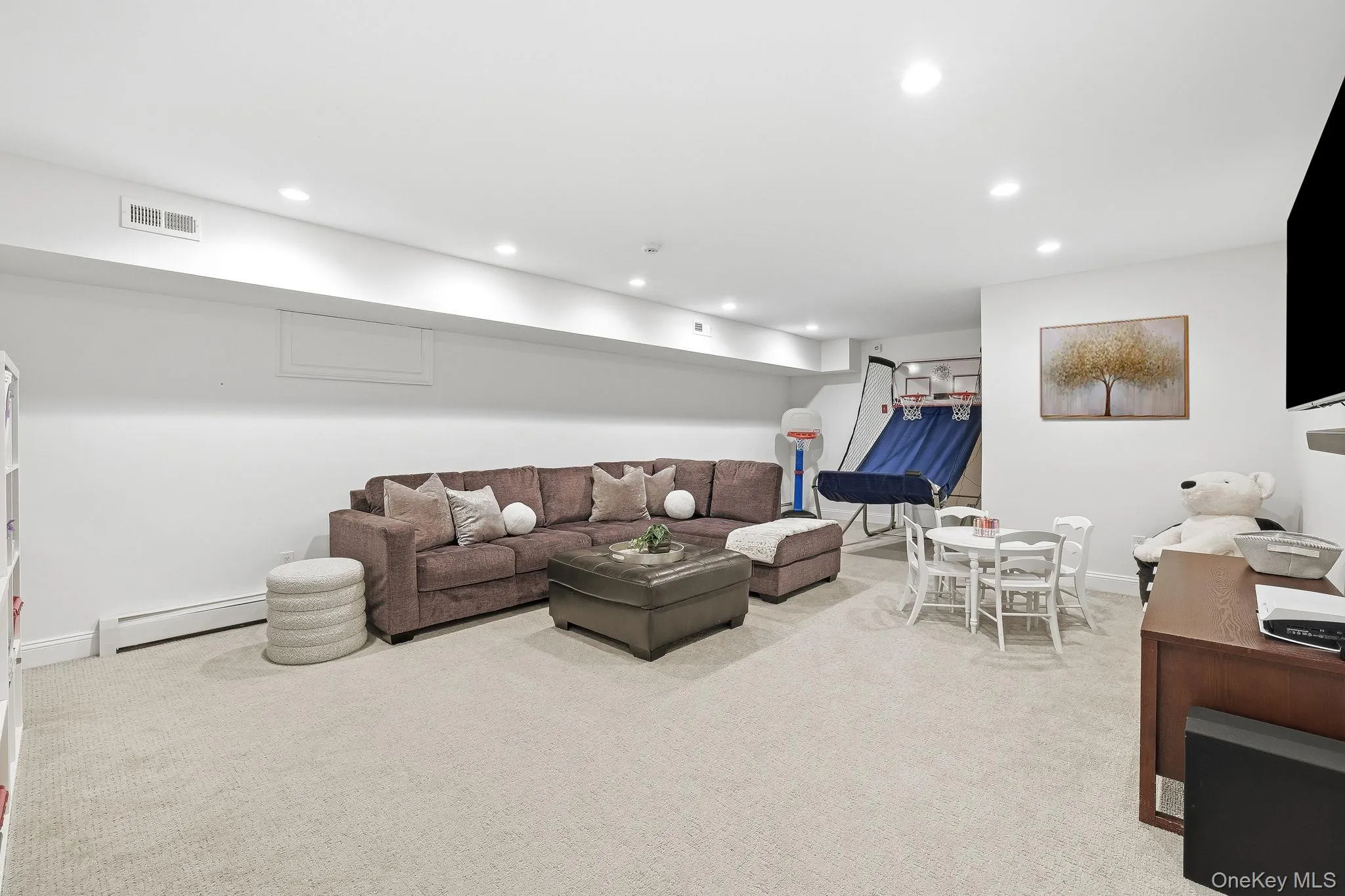 An alternate perspective showcasing the scale and comfort of the lower level. An alternate perspective showcasing the scale and comfort of the lower level.