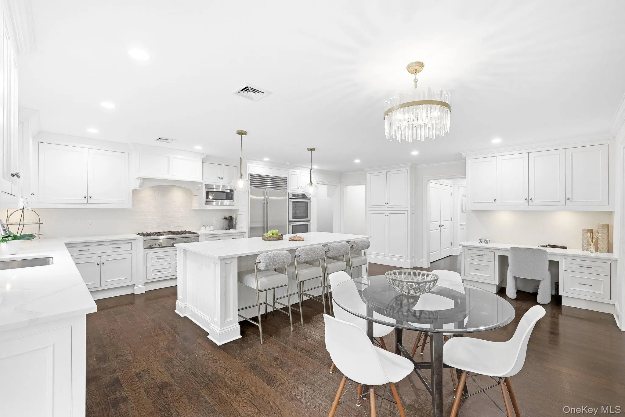 Stunning chef's kitchen offers plenty of space for your family to relax and unwind. Stunning chef's kitchen offers plenty of space for your family to relax and unwind.