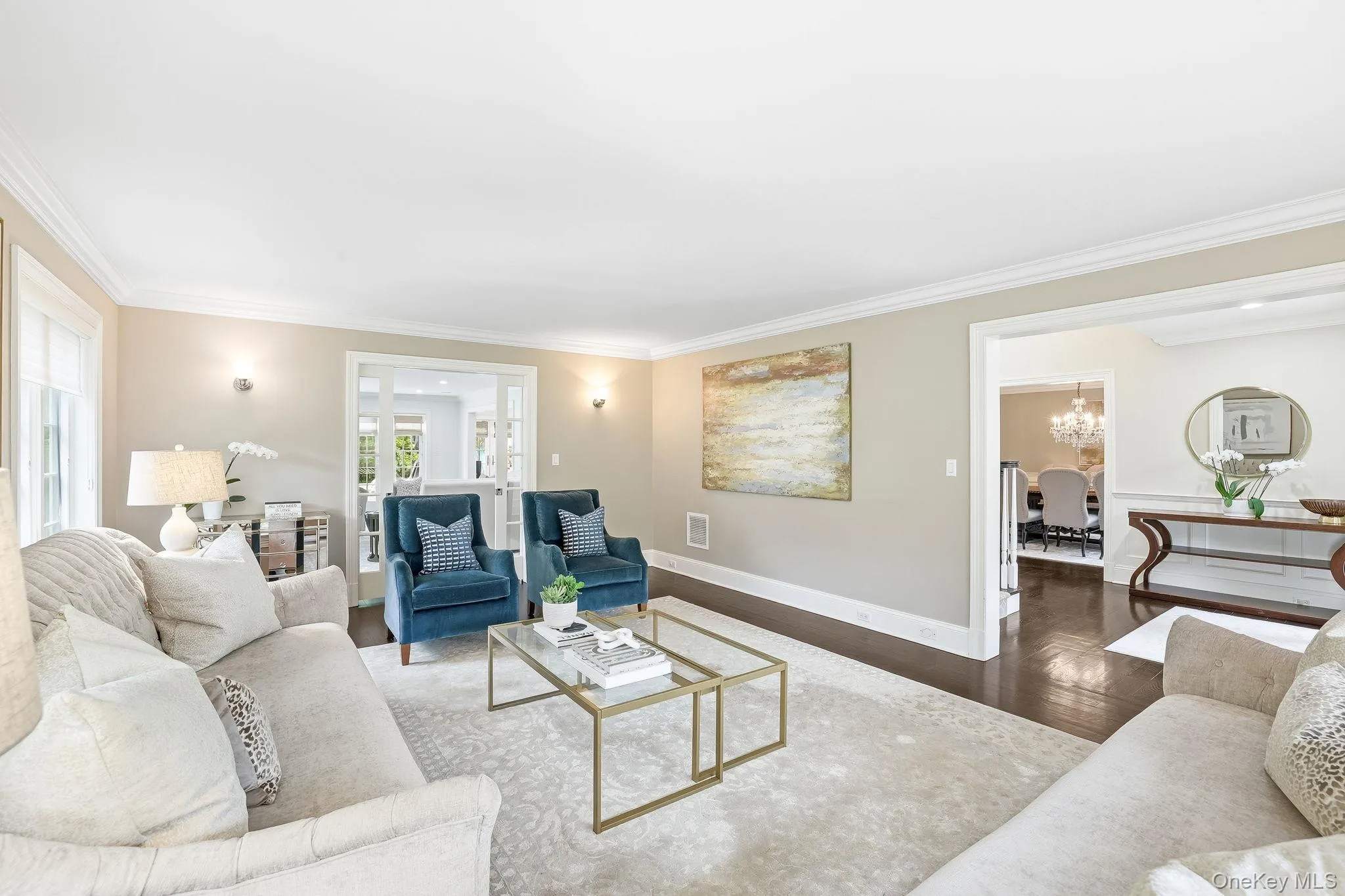 Alternate view of the expansive and sun-filled living room. Alternate view of the expansive and sun-filled living room.