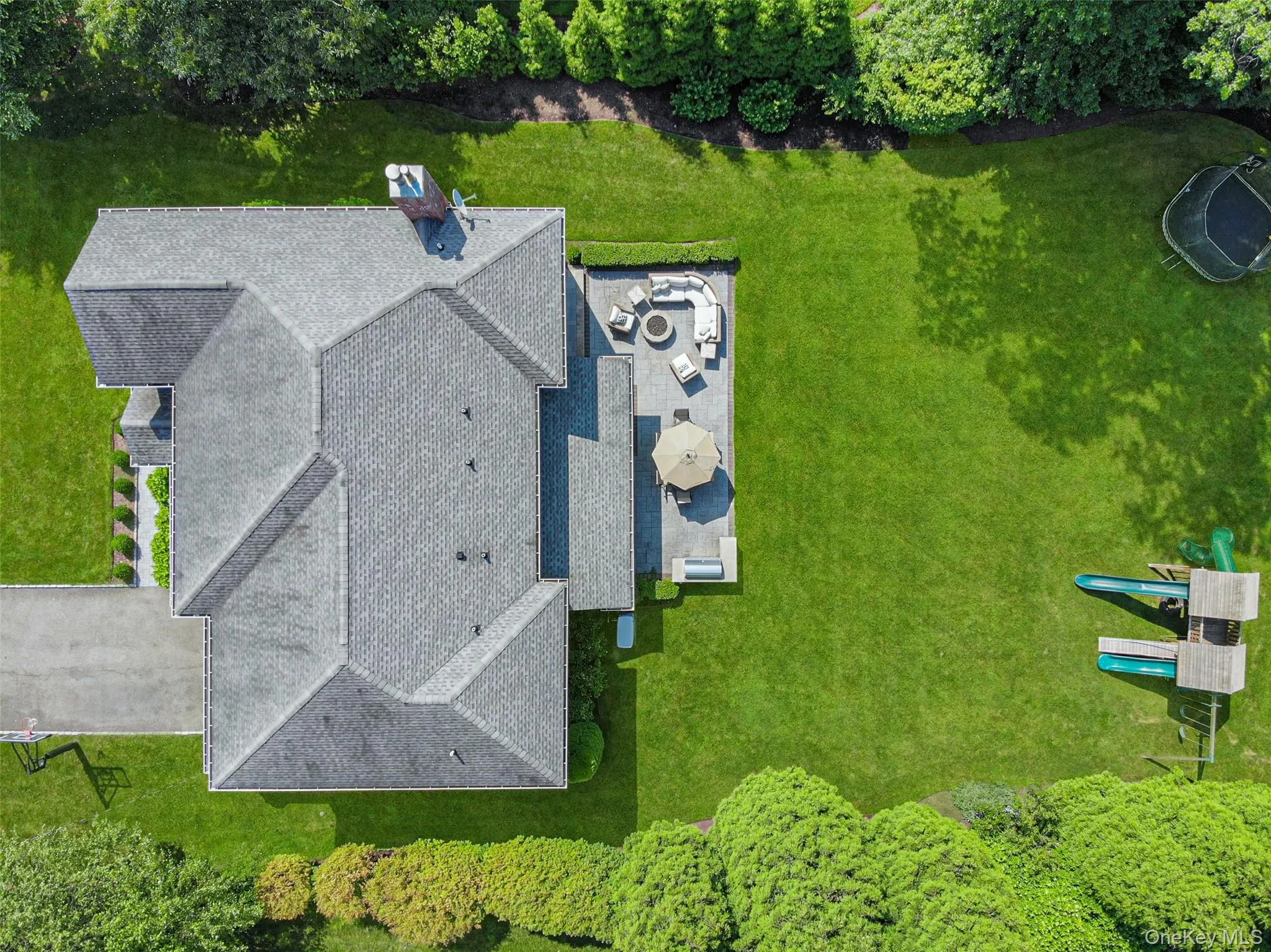 Aerial view showcasing this lush and private property in a quiet neighborhood. Aerial view showcasing this lush and private property in a quiet neighborhood.