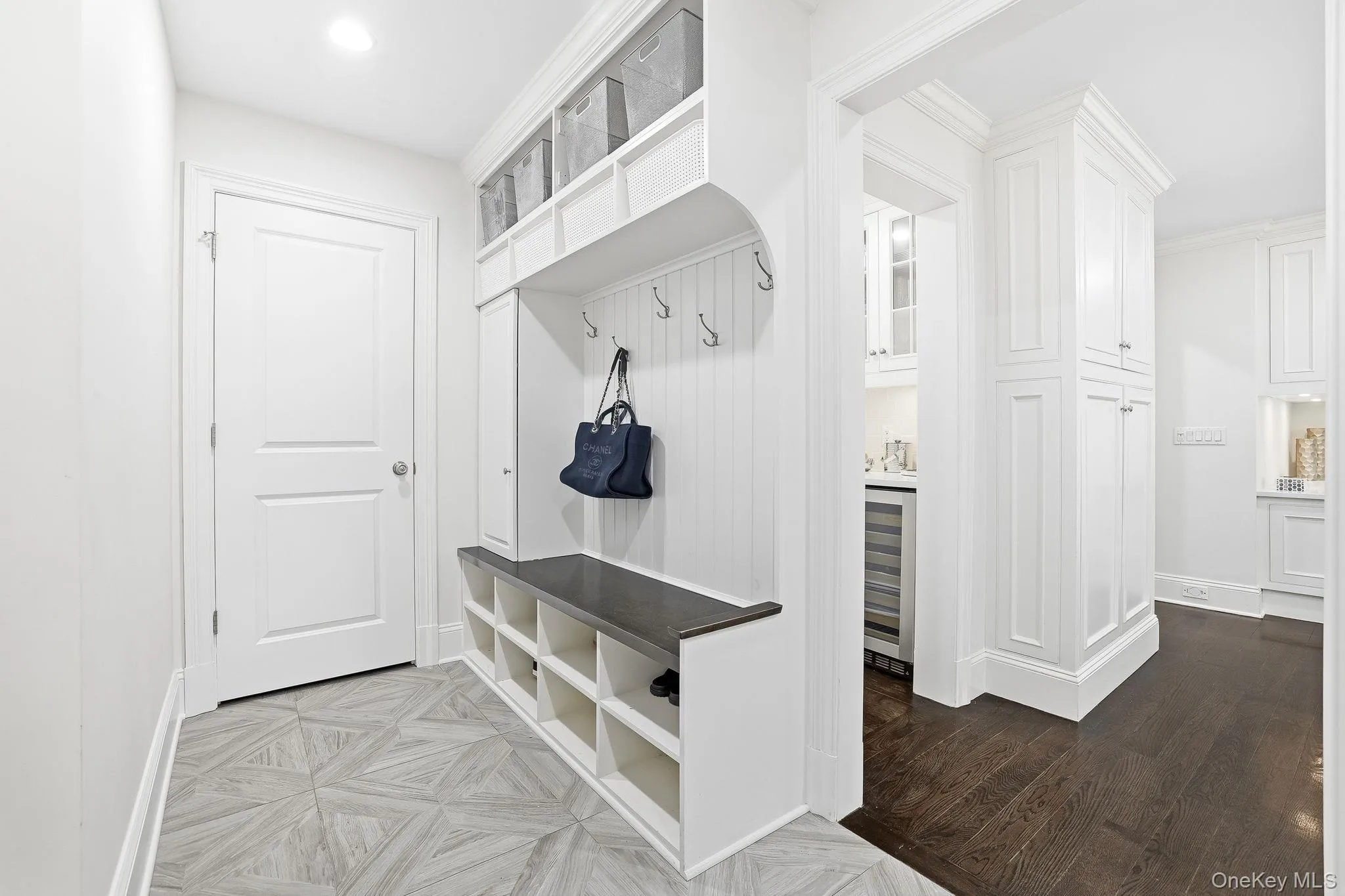 Conveniently located right off the kitchen, this mudroom with pantry closet offers easy access to the garage for everyday living. Conveniently located right off the kitchen, this mudroom with pantry closet offers easy access to the garage for everyday living.