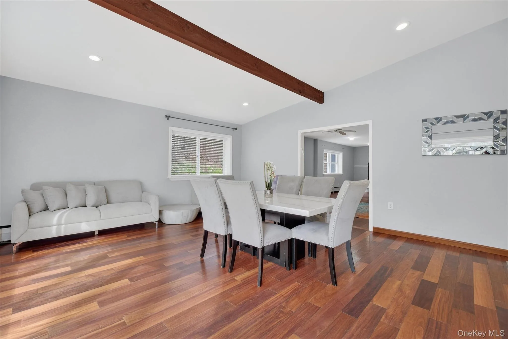Dining area featuring recessed lighting, dark wood-style flooring, and lofted ceiling with beams Dining area featuring recessed lighting, dark wood-style flooring, and lofted ceiling with beams