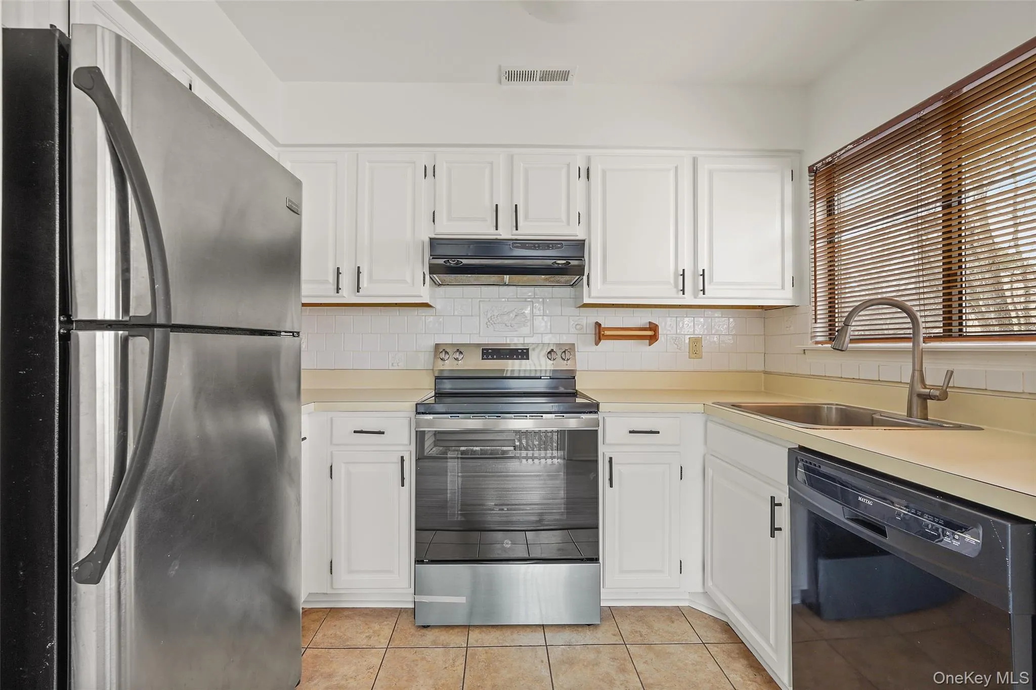 Kitchen with stainless steel appliances. Kitchen with stainless steel appliances.