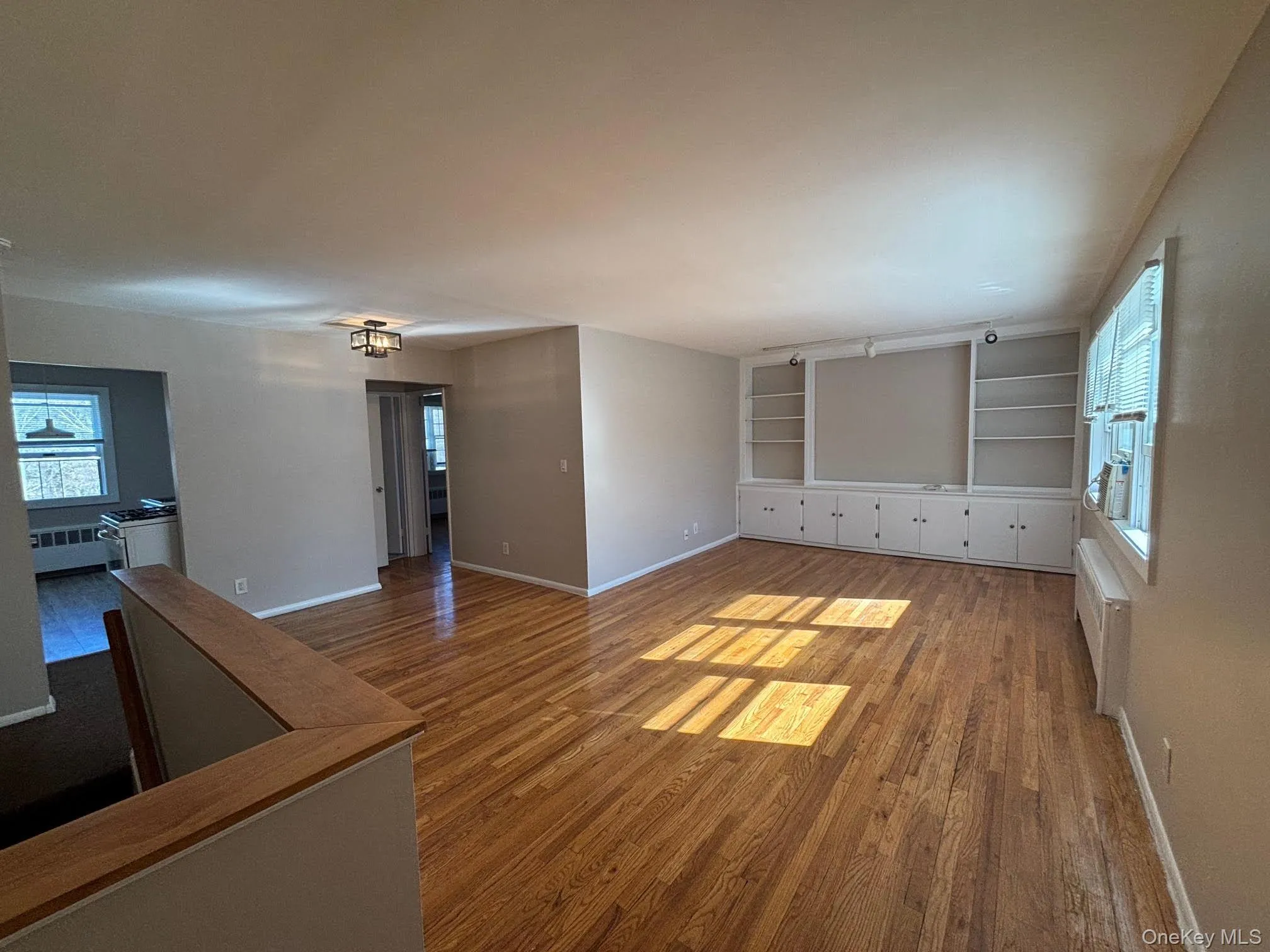 Living room with built in wall unit and storage. Living room with built in wall unit and storage.
