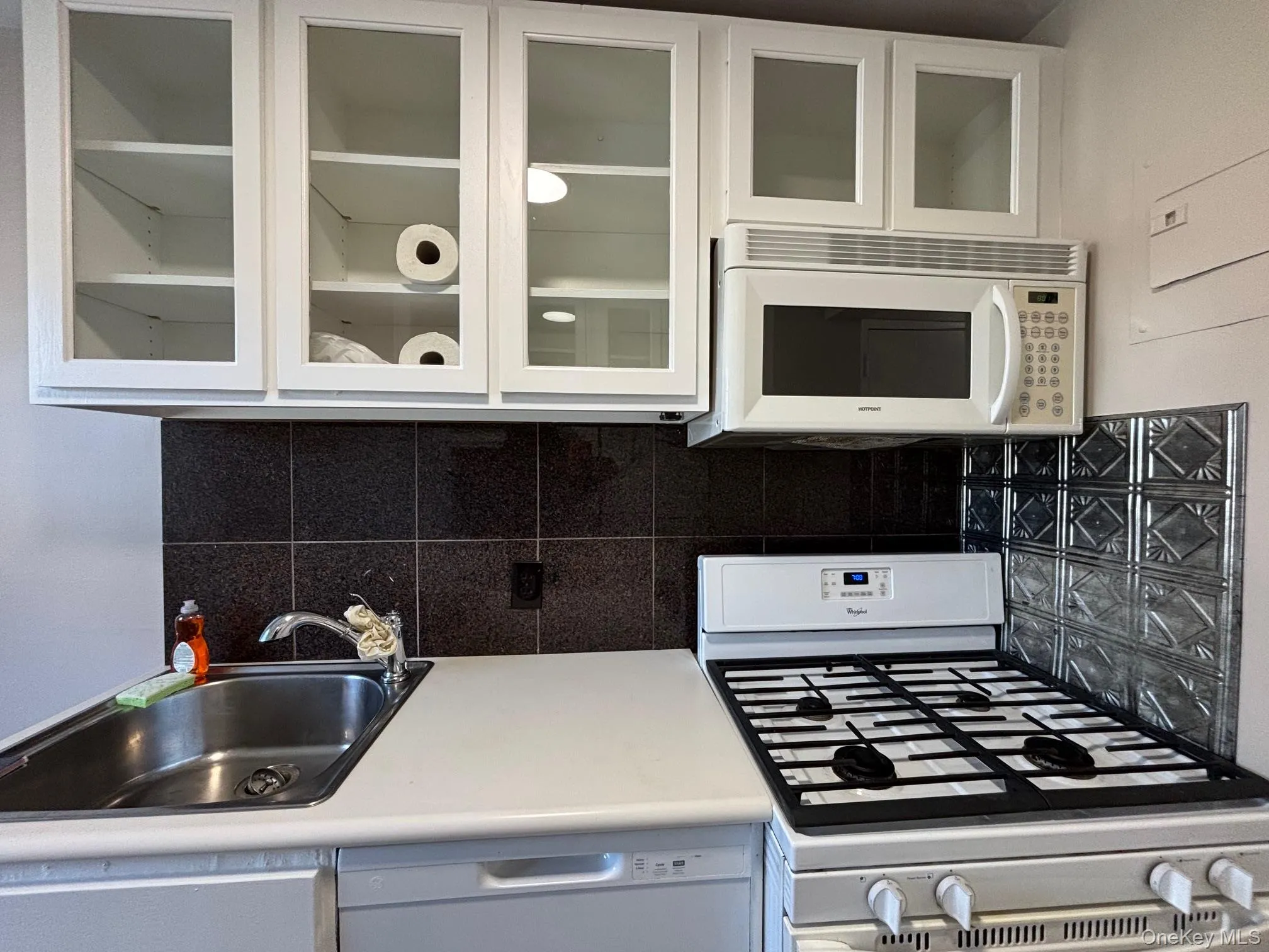 Kitchen with gas oven and microwave. Kitchen with gas oven and microwave.