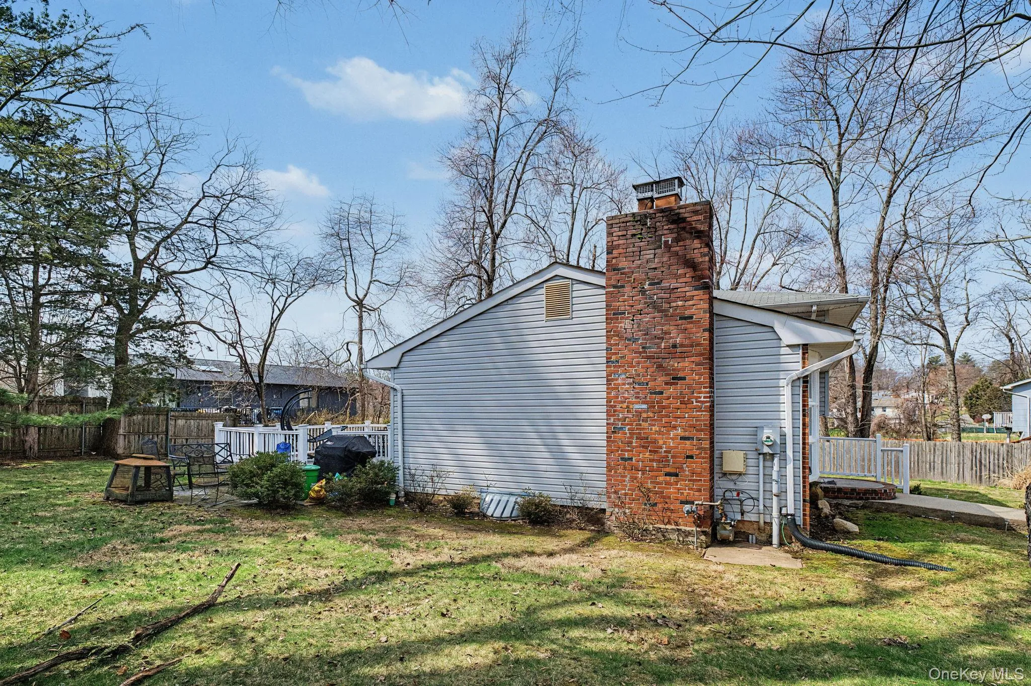 Side of home with chimney. Side of home with chimney.