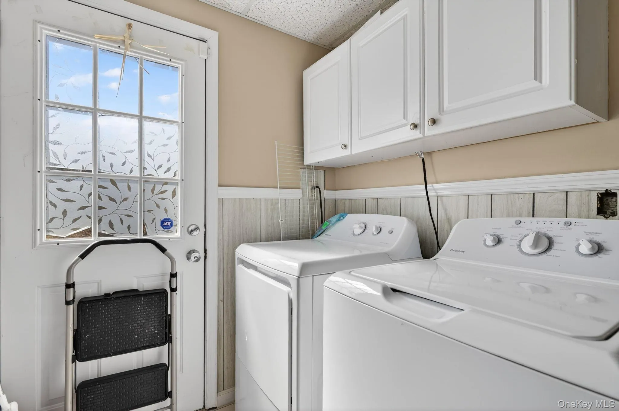 Laundry room with access to backyard. Laundry room with access to backyard.