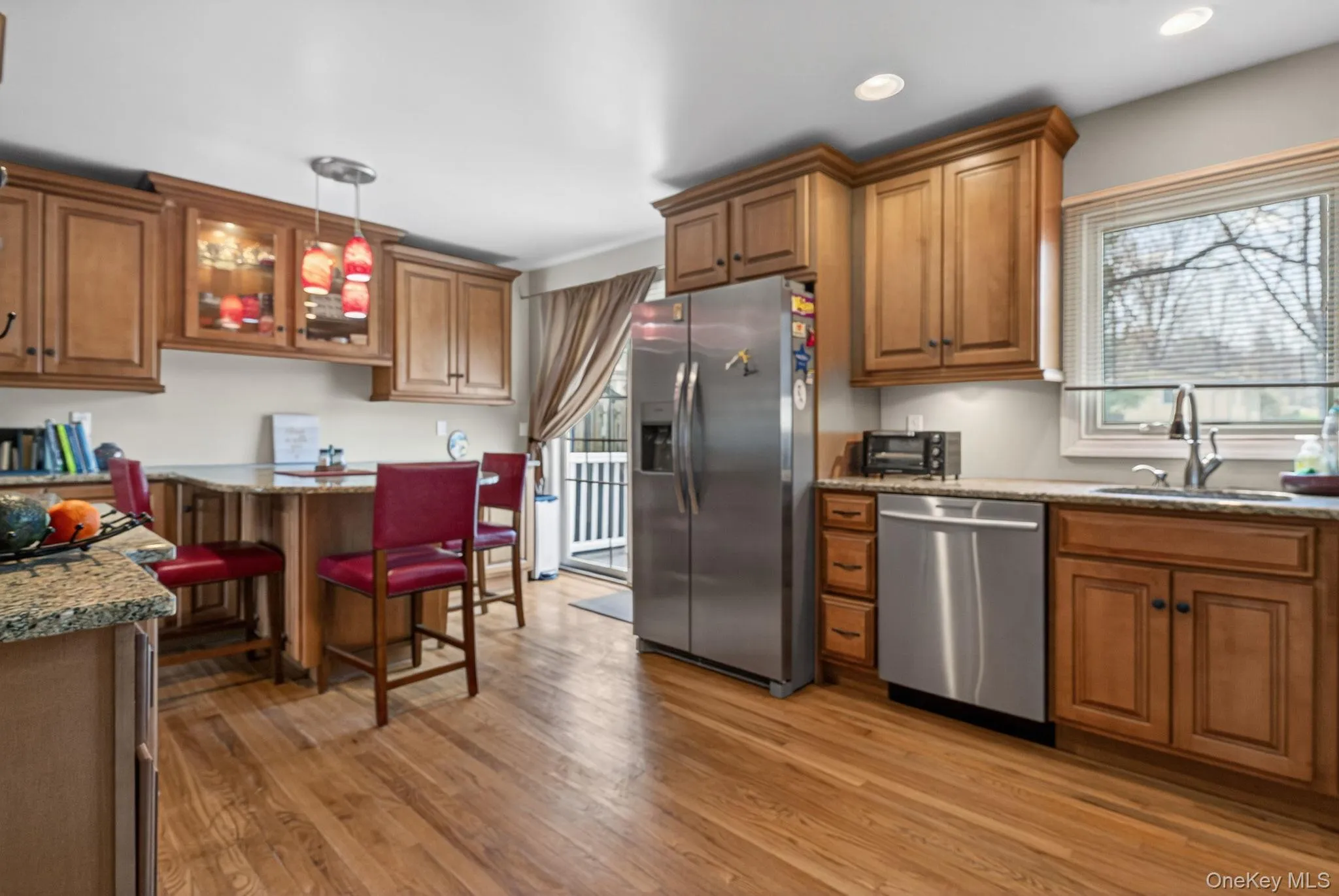 Kitchen with granite countertops, stainless steel appliances and peninsula. Kitchen with granite countertops, stainless steel appliances and peninsula.