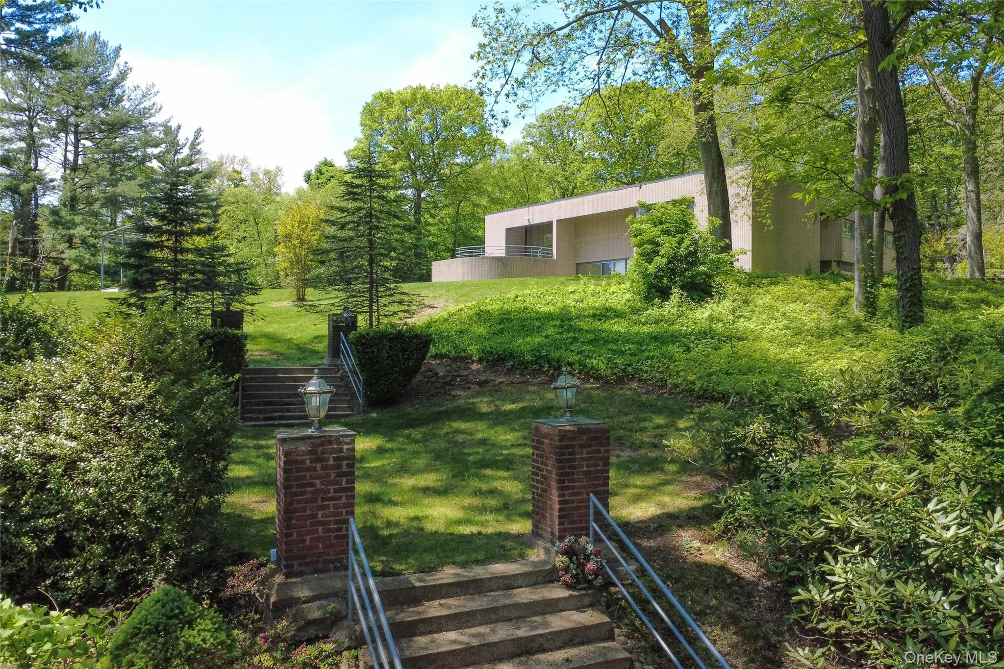 View of green lawn featuring stairs View of green lawn featuring stairs