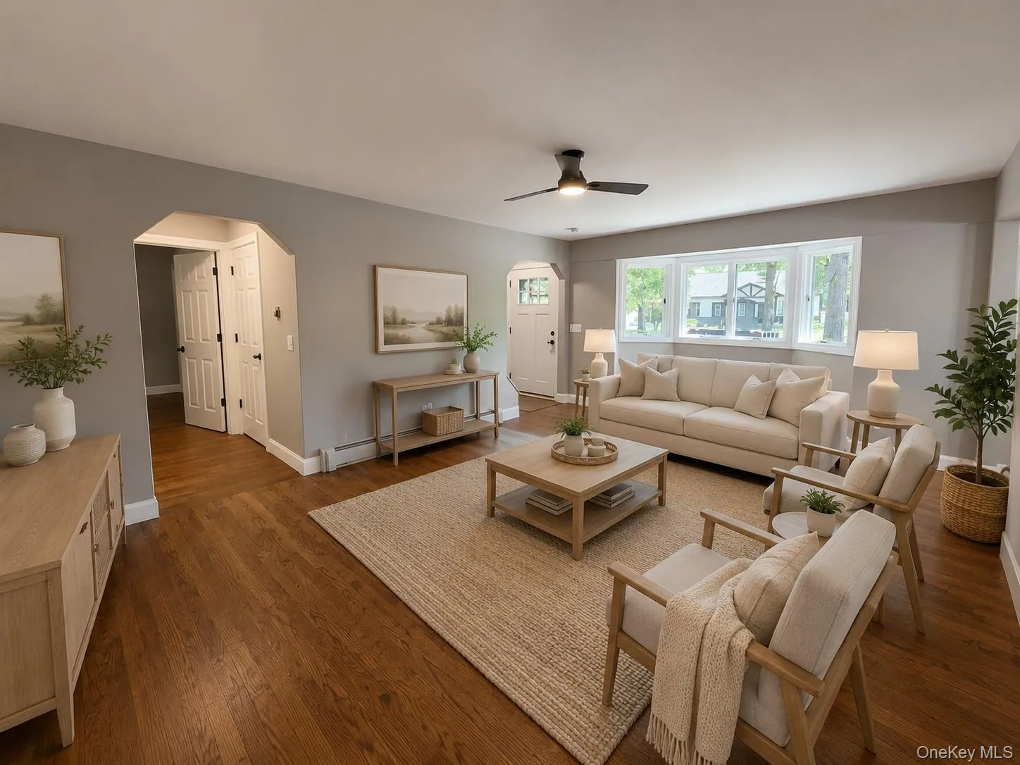 AI- Staged- Spacious living area featuring wood-finish flooring, recessed lighting, and a ceiling fan AI- Staged- Spacious living area featuring wood-finish flooring, recessed lighting, and a ceiling fan