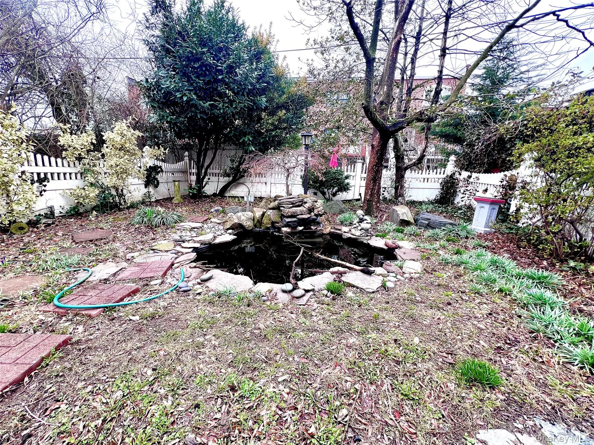 Featuring a waterfall pond. Featuring a waterfall pond.