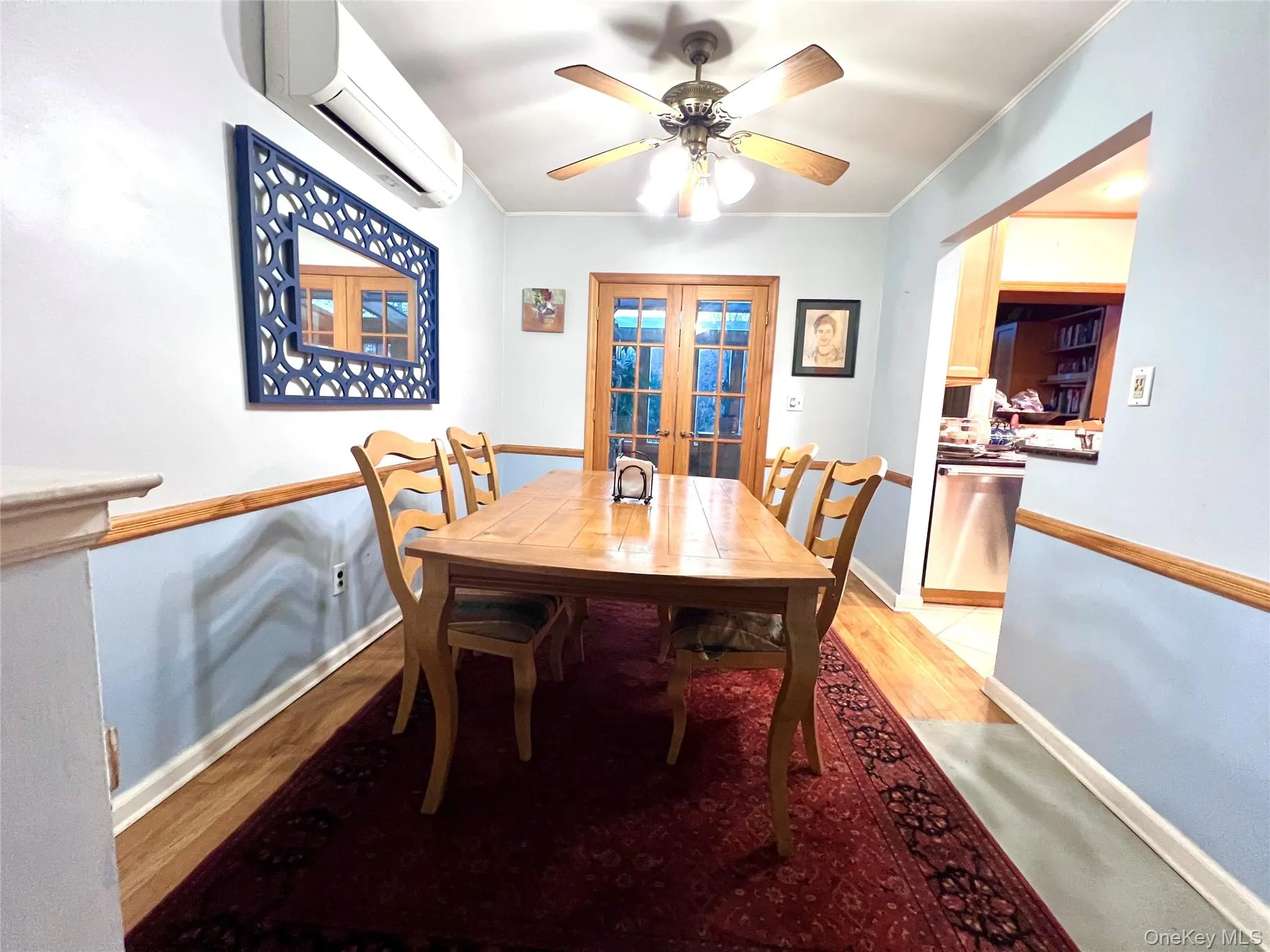 Formal dining area , featuring ceiling fan, ductless minisplit heating and AC. French door to the solarium and back porch.Hardwood floor. Formal dining area , featuring ceiling fan, ductless minisplit heating and AC. French door to the solarium and back porch.Hardwood floor.