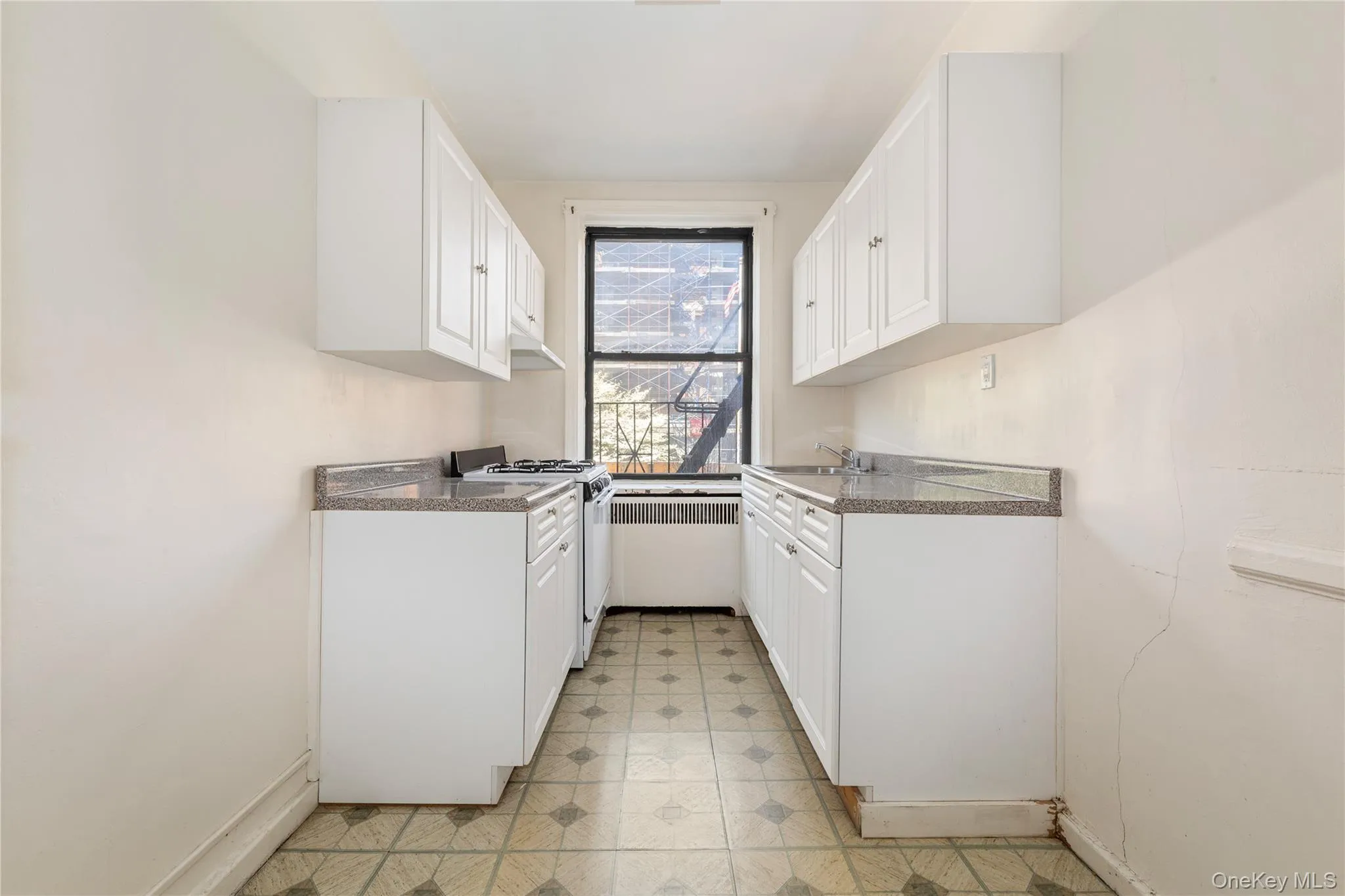 White cabinets and window for ventilation. White cabinets and window for ventilation.