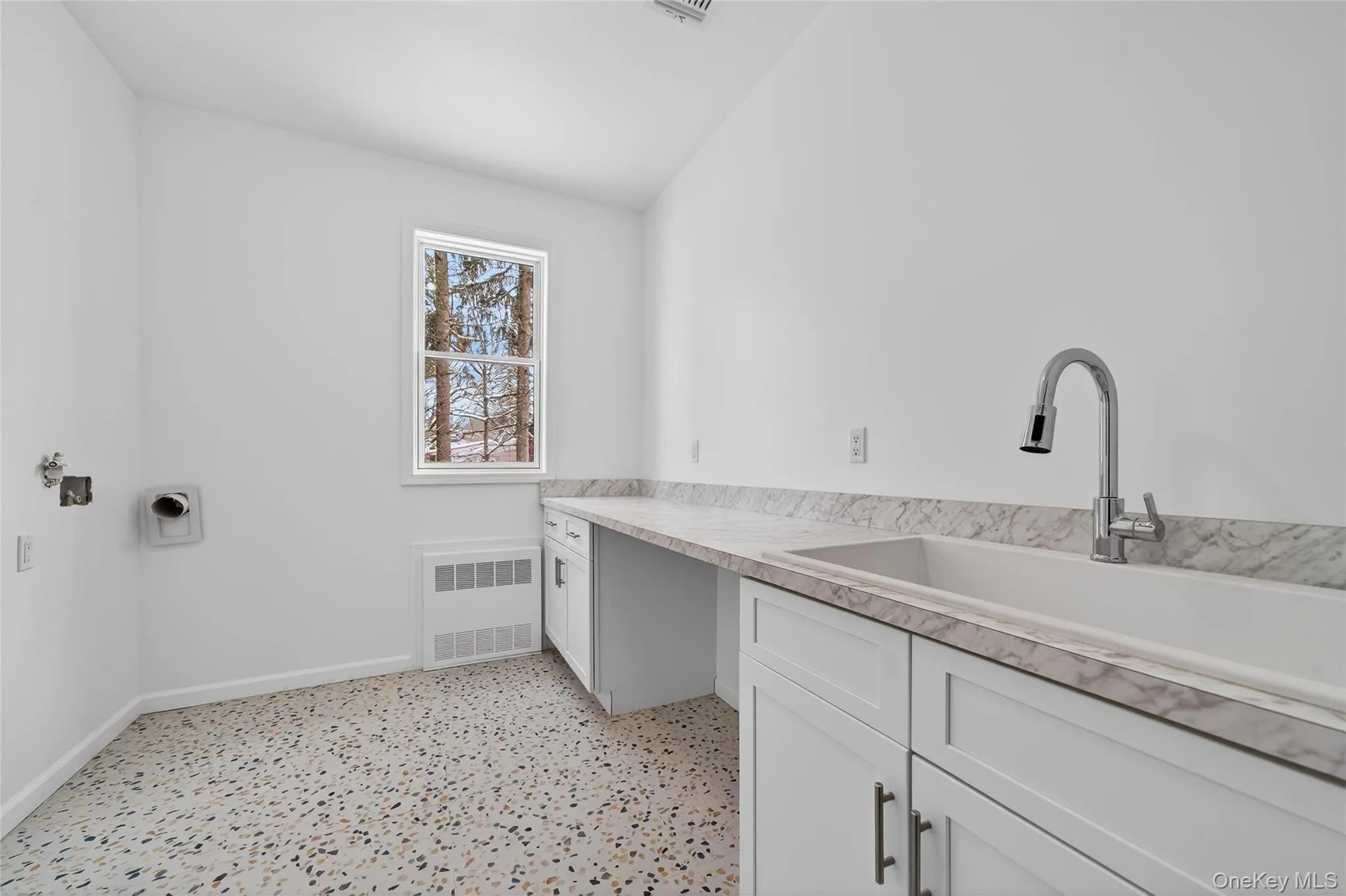 Laundry room featuring cabinet space, hookup for a washing machine, hookup for an electric dryer, and light flooring Laundry room featuring cabinet space, hookup for a washing machine, hookup for an electric dryer, and light flooring