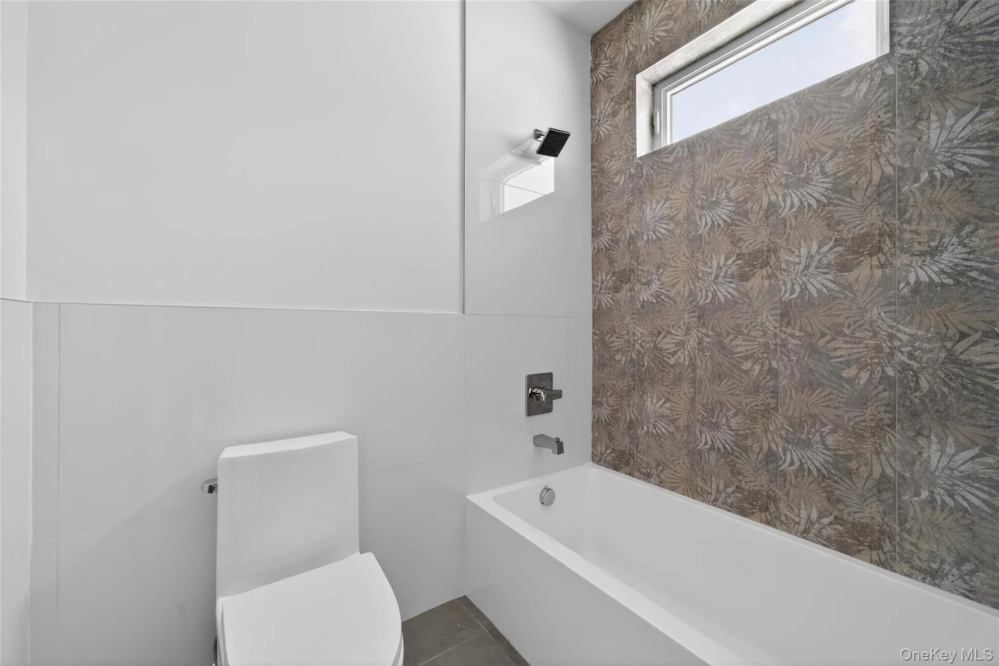 Bathroom with tile walls and tub / shower combination Bathroom with tile walls and tub / shower combination