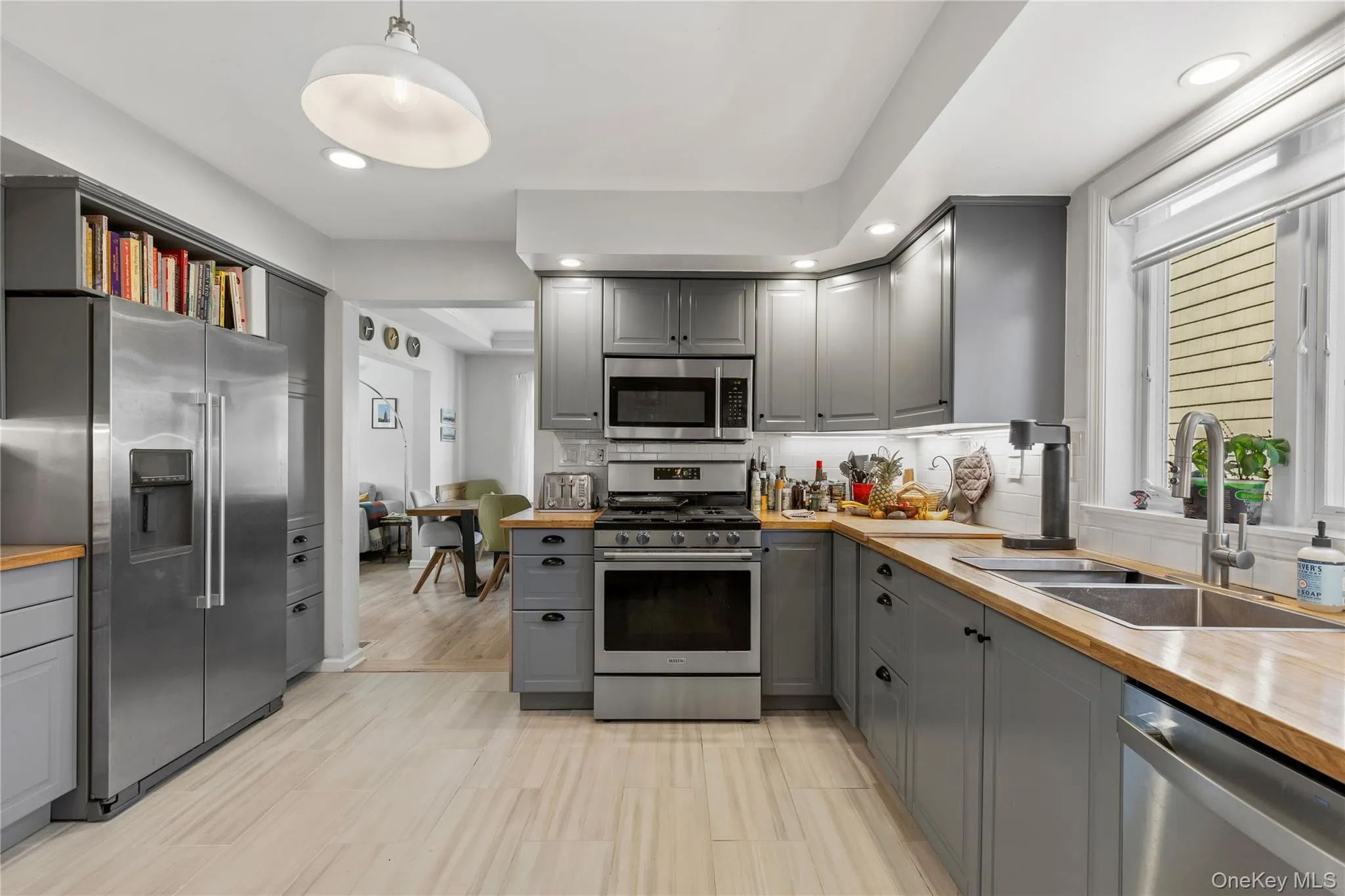 Modern eat-in-kitchen features stainless steel appliance Modern eat-in-kitchen features stainless steel appliance