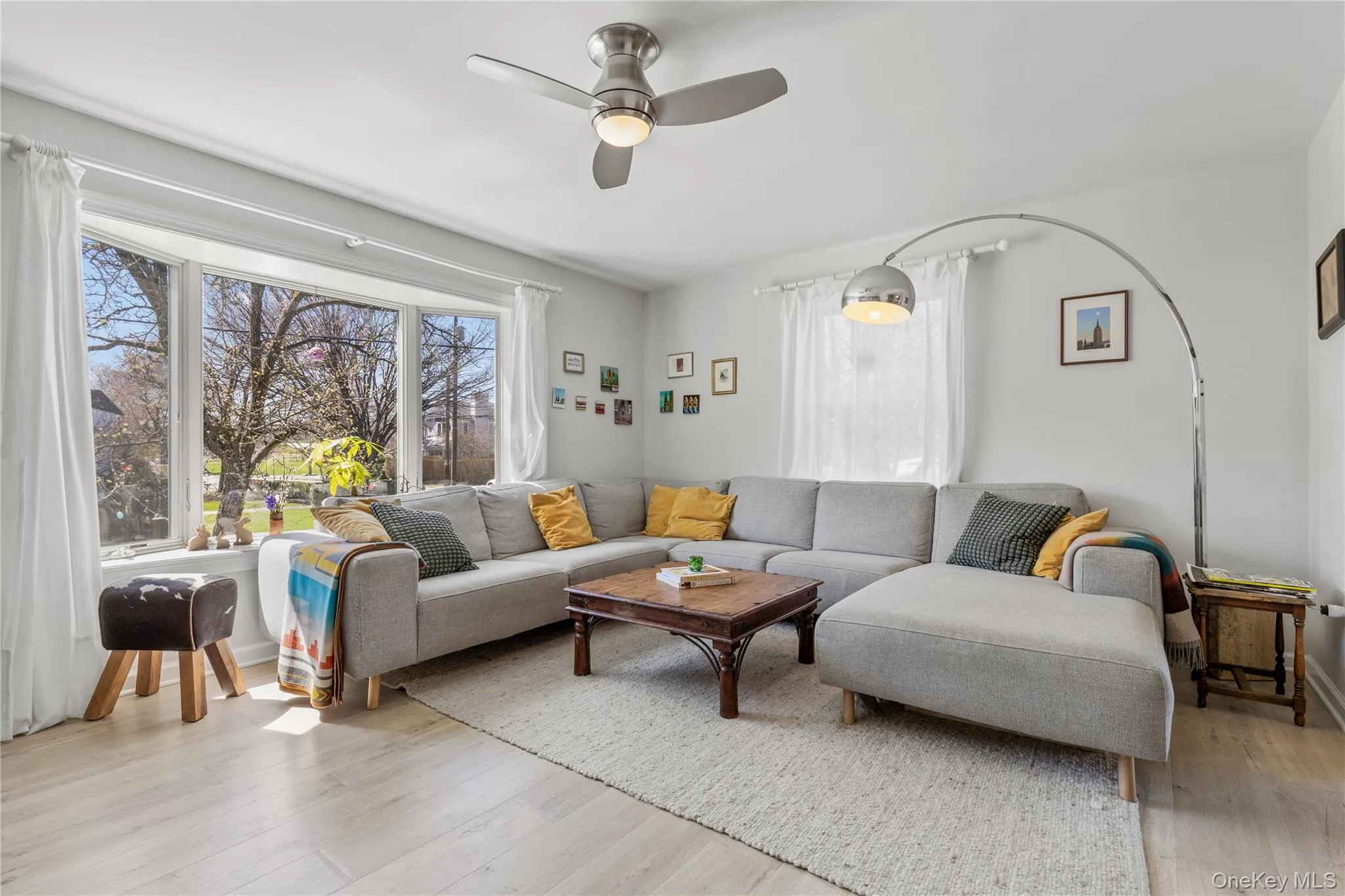 HDWD floors throughout home, living room features a large bay window in front HDWD floors throughout home, living room features a large bay window in front