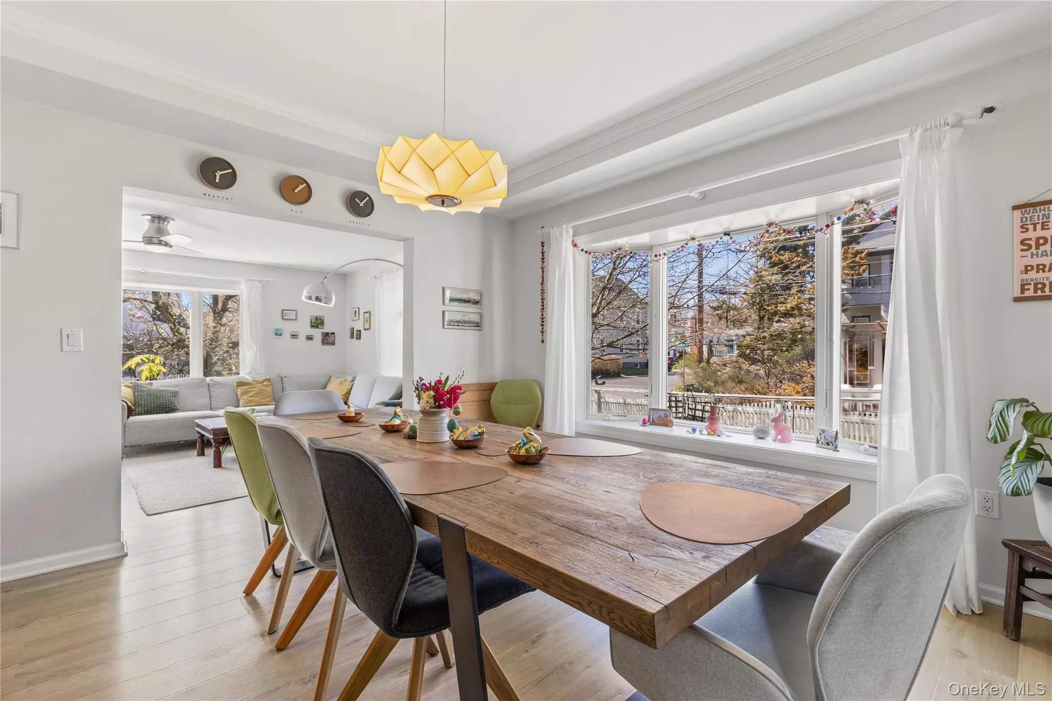 Airy and bright dining room enhanced by an elegant tray ceiling Airy and bright dining room enhanced by an elegant tray ceiling