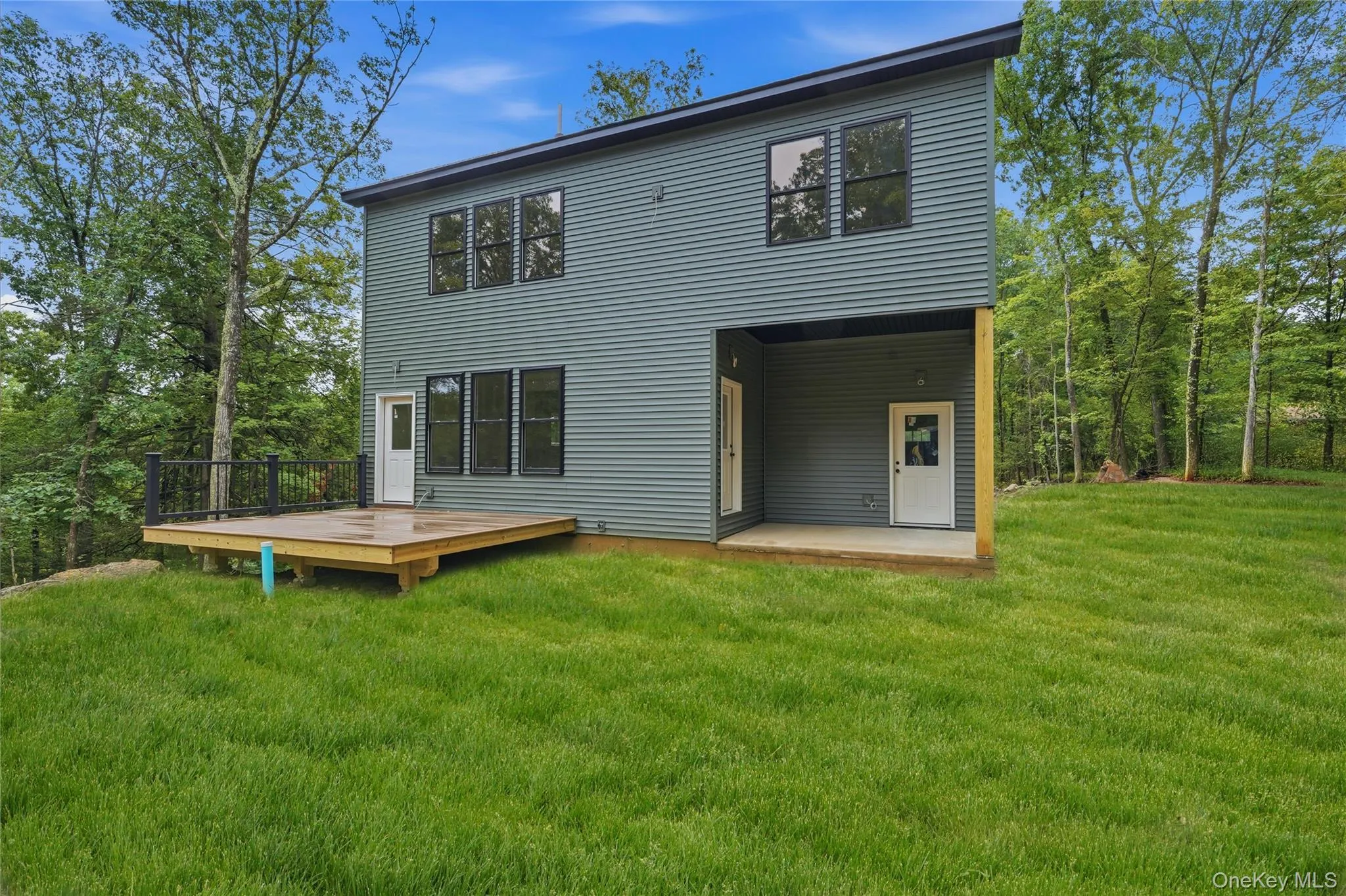 This photo has been digitally edited. Grass was added. Front door and garage door were changed to black to show what the home will look like once finished. This photo has been digitally edited. Grass was added. Front door and garage door were changed to black to show what the home will look like once finished.