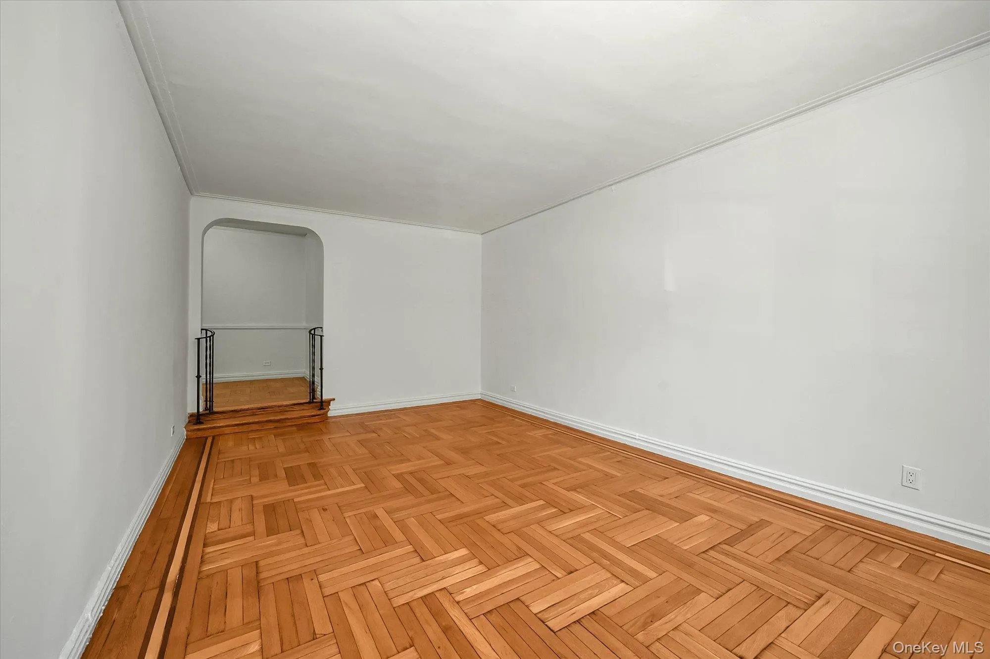 Bedroom featuring parquet flooring. Bedroom featuring parquet flooring.