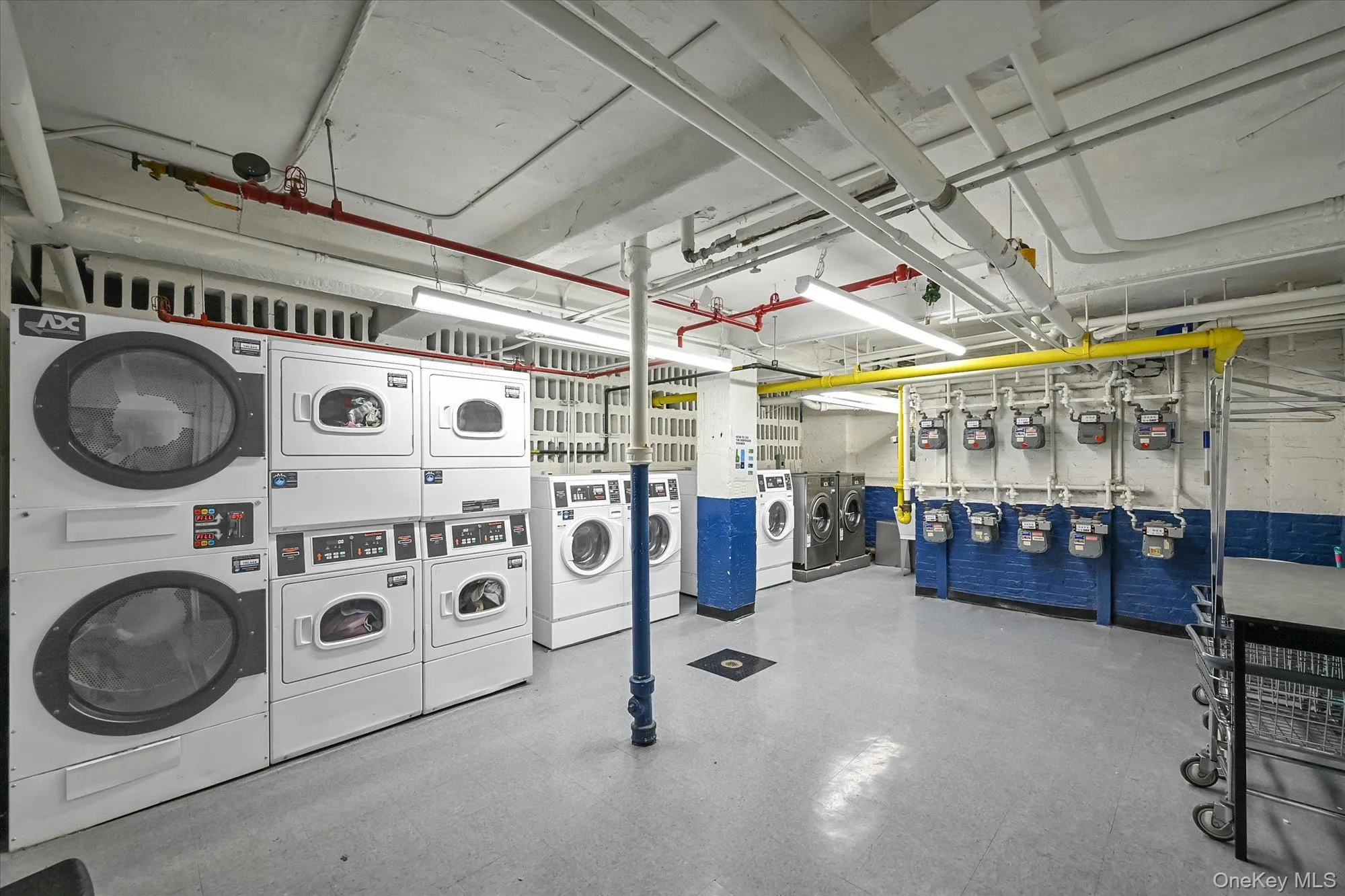 Laundry room with stacked washing machine and dryer. Laundry room with stacked washing machine and dryer.