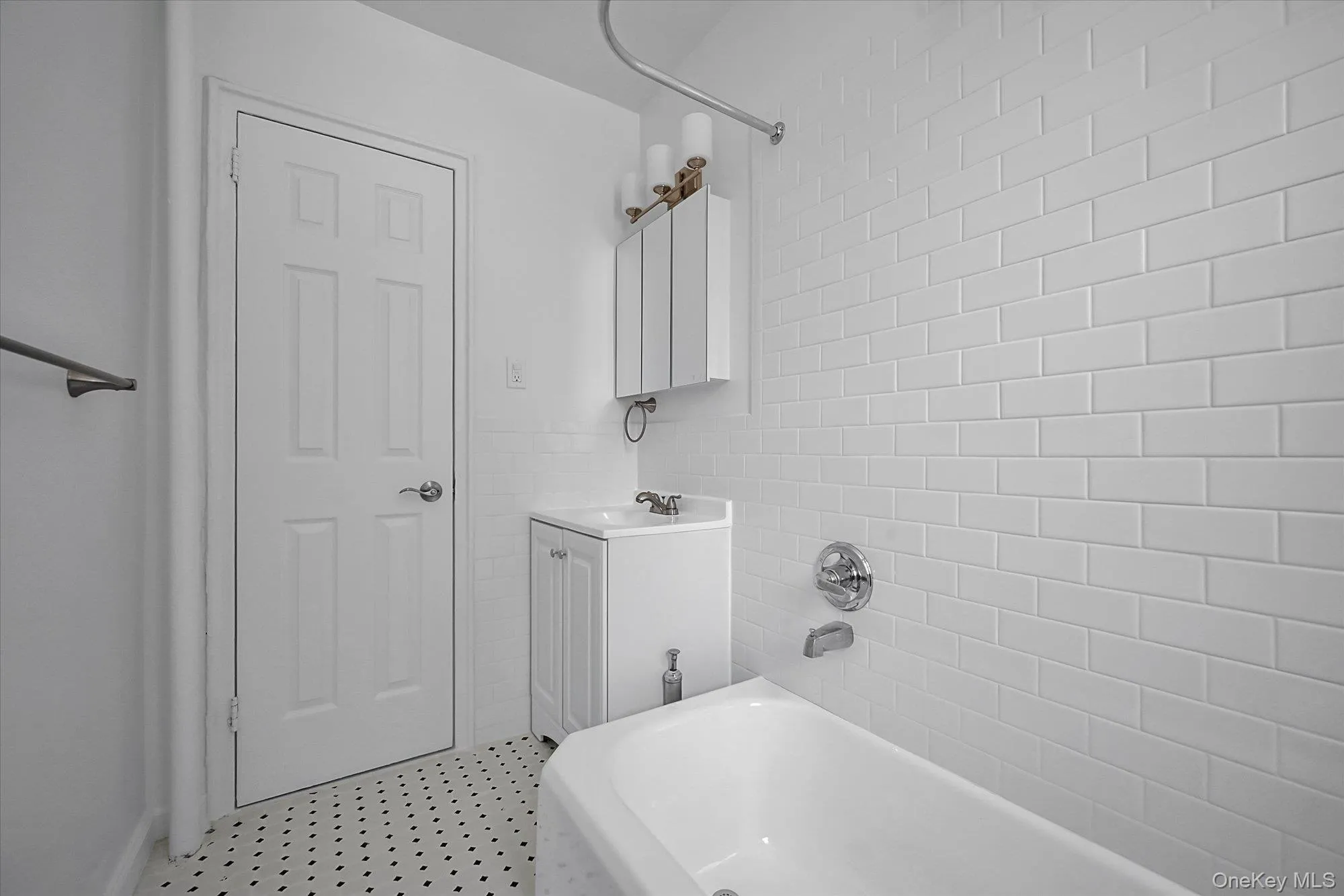 Full bathroom featuring vanity and shower / bathtub combination Full bathroom featuring vanity and shower / bathtub combination