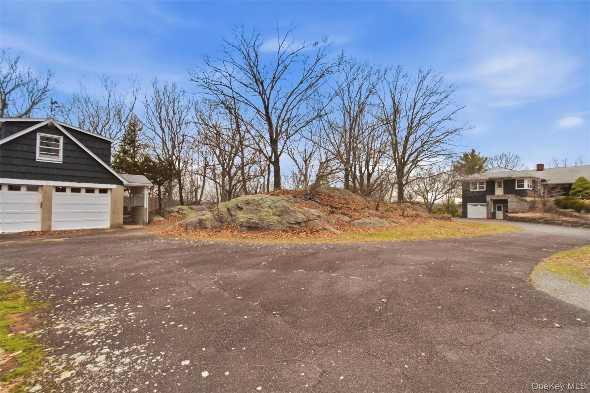 Detached 3 car garage with guest quarters above and guest patio with built-in wood grill and woodland views. Detached 3 car garage with guest quarters above and guest patio with built-in wood grill and woodland views.