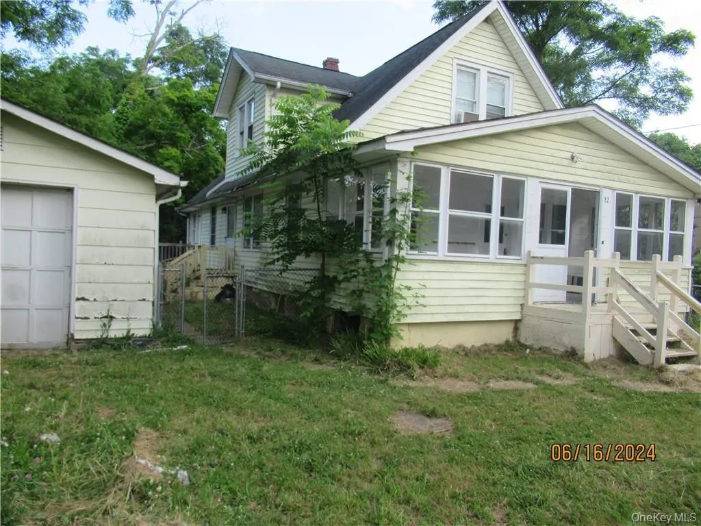 of house featuring a yard of house featuring a yard