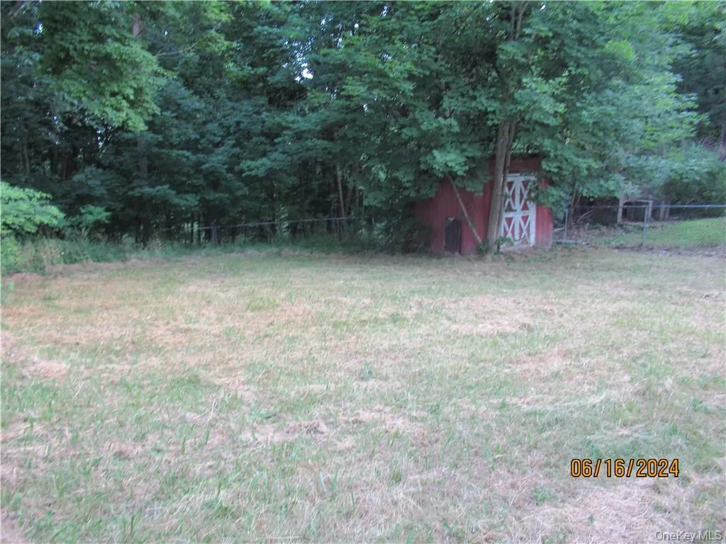 View of yard with a shed View of yard with a shed