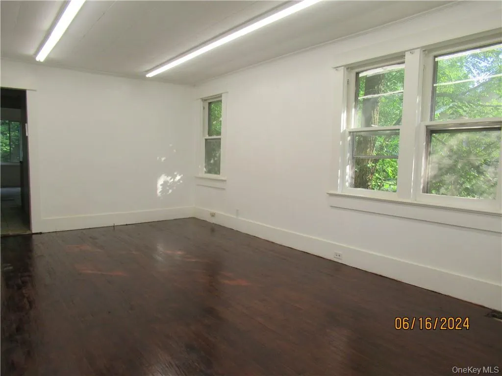 bright and spacious living room with wood-type flooring bright and spacious living room with wood-type flooring