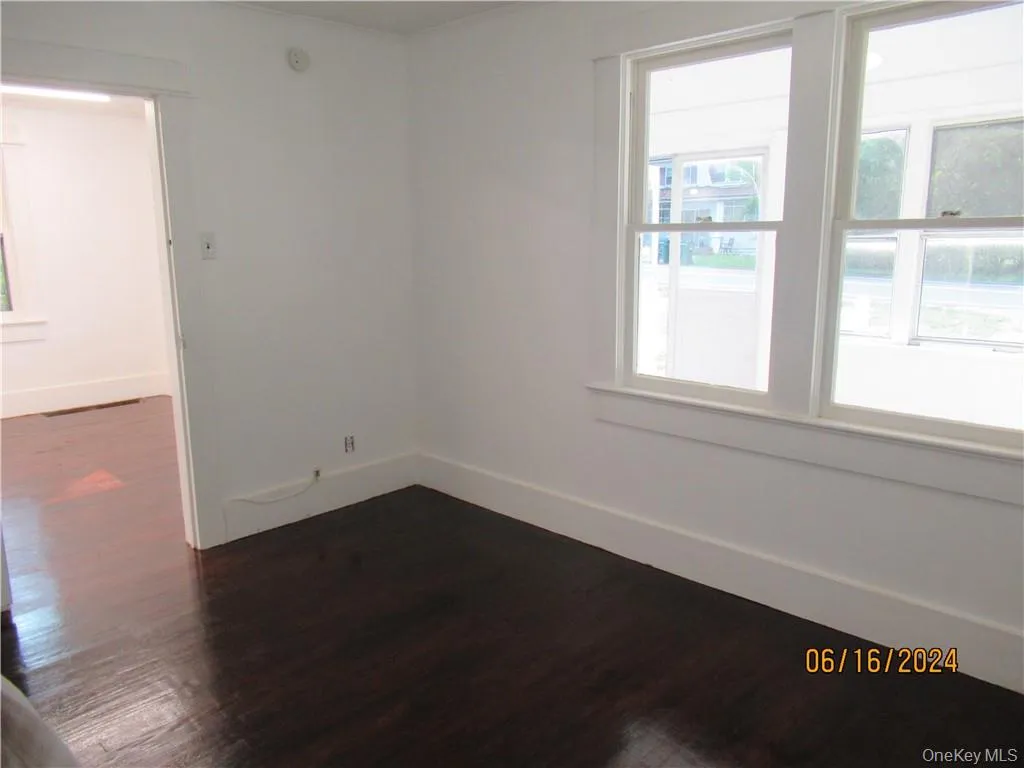 Bedroom 1 with plenty of natural light and hardwood / wood-style flooring Bedroom 1 with plenty of natural light and hardwood / wood-style flooring