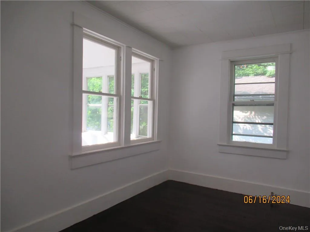 Bedroom 1 with plenty of natural light and hardwood / wood-style flooring Bedroom 1 with plenty of natural light and hardwood / wood-style flooring