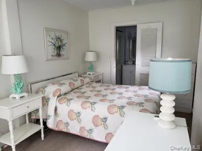 Bedroom with carpet flooring Bedroom with carpet flooring