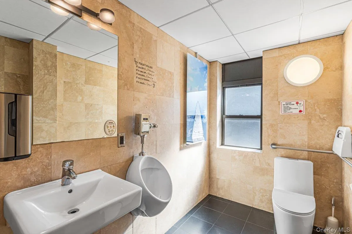 Windowed Bathroom with tile walls Windowed Bathroom with tile walls