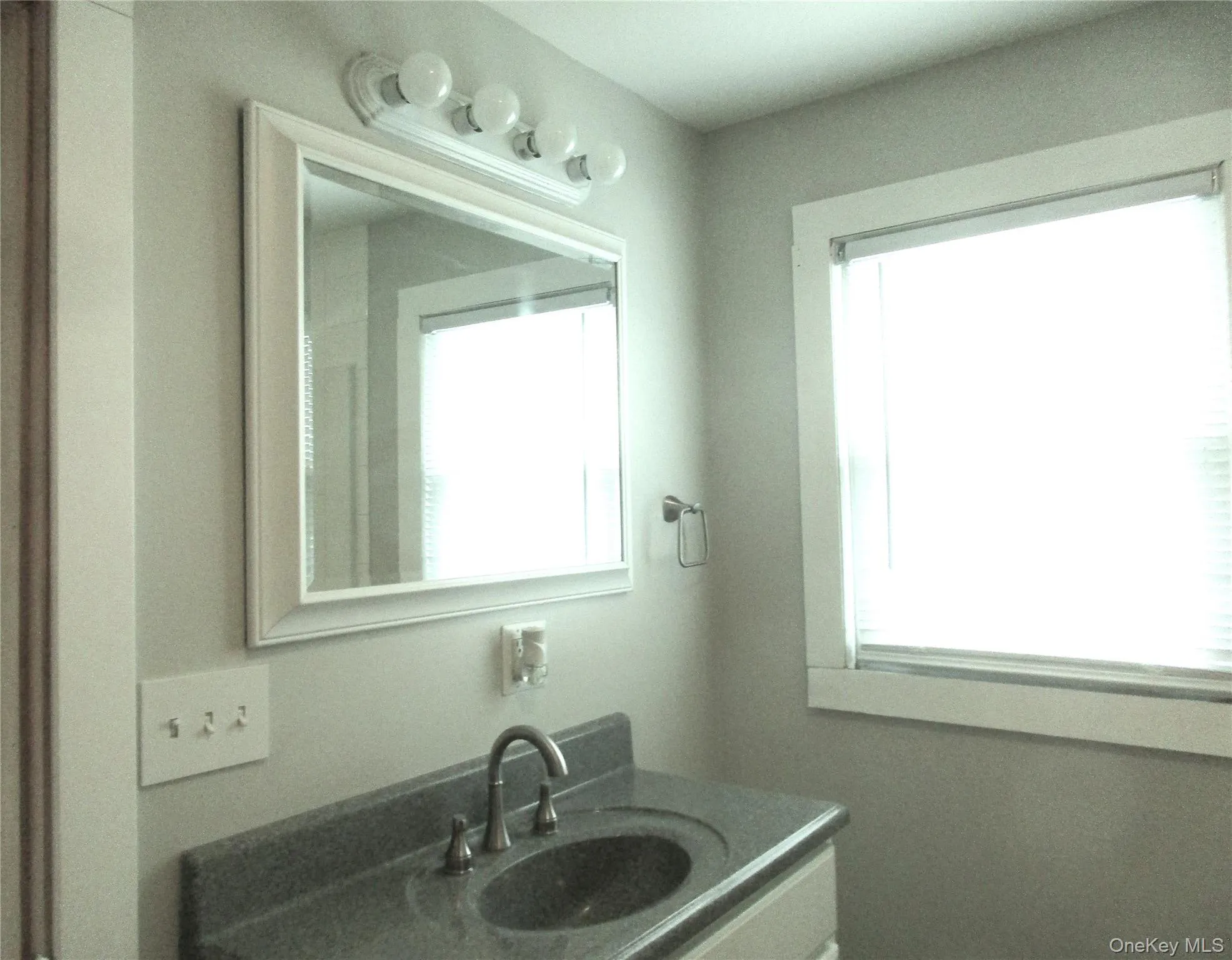 Large mirror & lights above sink Large mirror & lights above sink