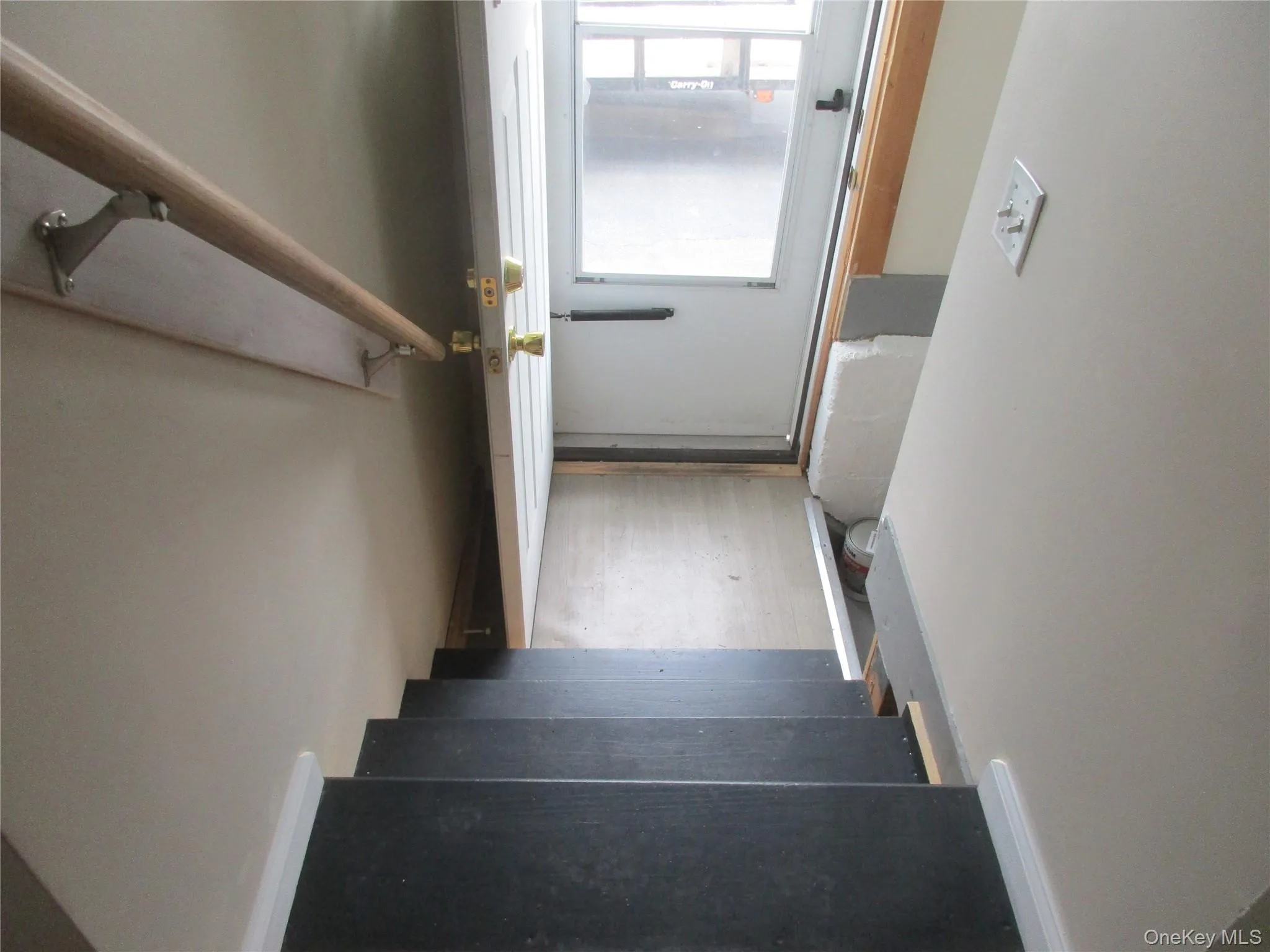 Stairs by kitchen to side door -basement steps on right by door Stairs by kitchen to side door -basement steps on right by door
