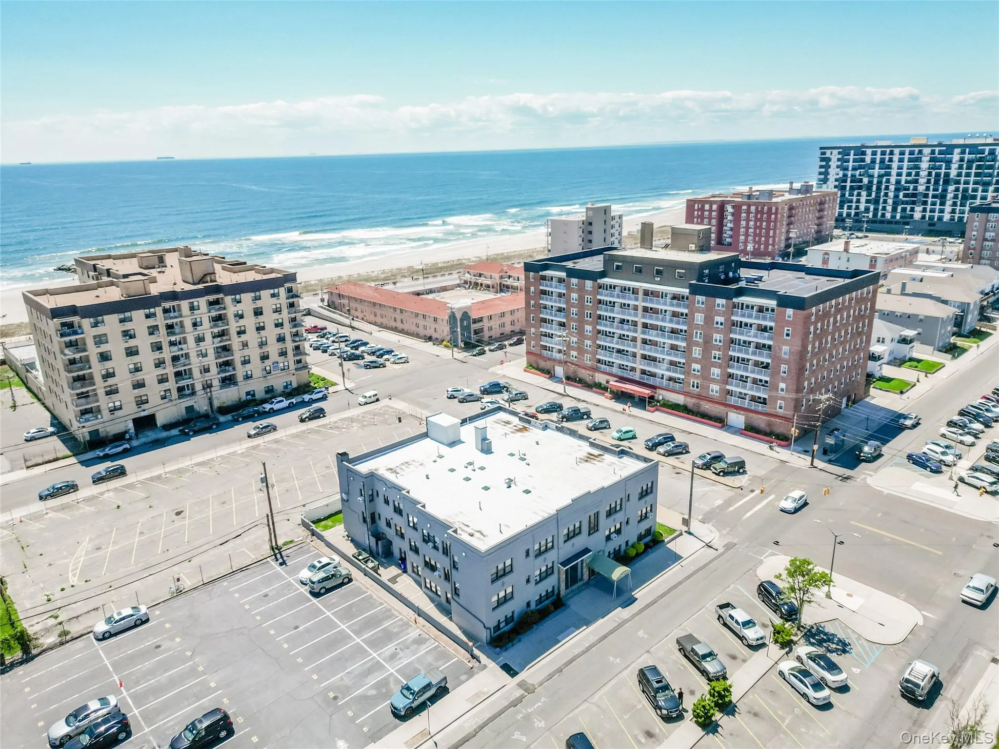 View of urban area with a nearby body of water and apartment complex View of urban area with a nearby body of water and apartment complex