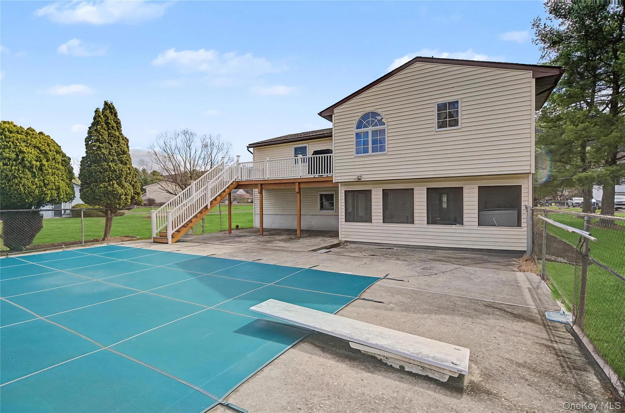 Back of property with a fenced backyard and a patio Back of property with a fenced backyard and a patio