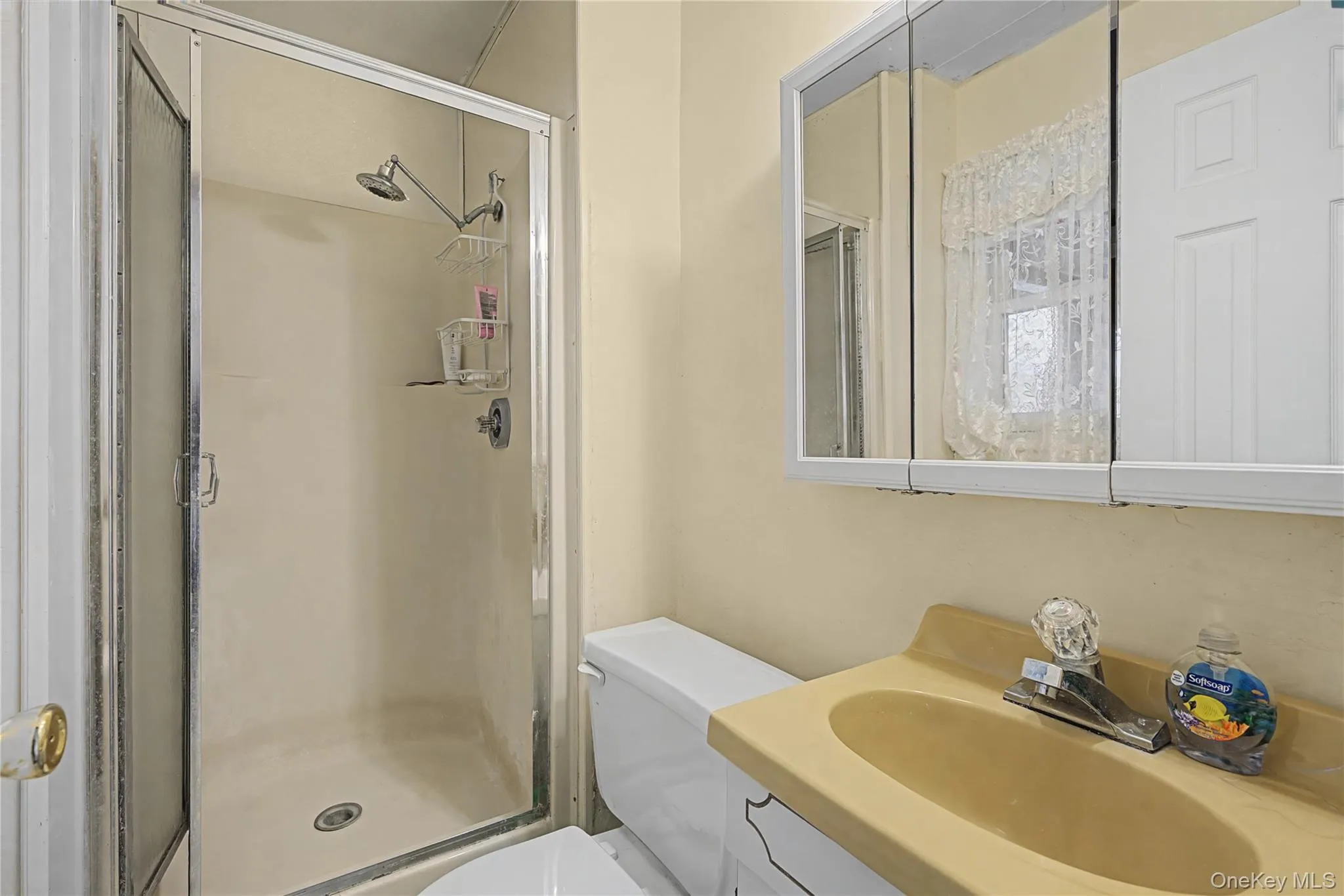 Full bath with vanity and a shower stall Full bath with vanity and a shower stall