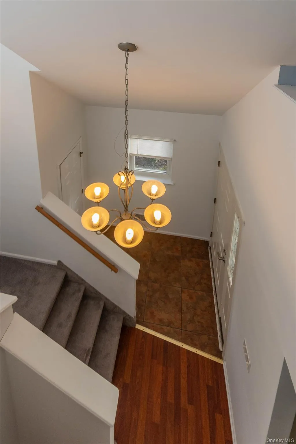 upstairs looking down at front entry upstairs looking down at front entry